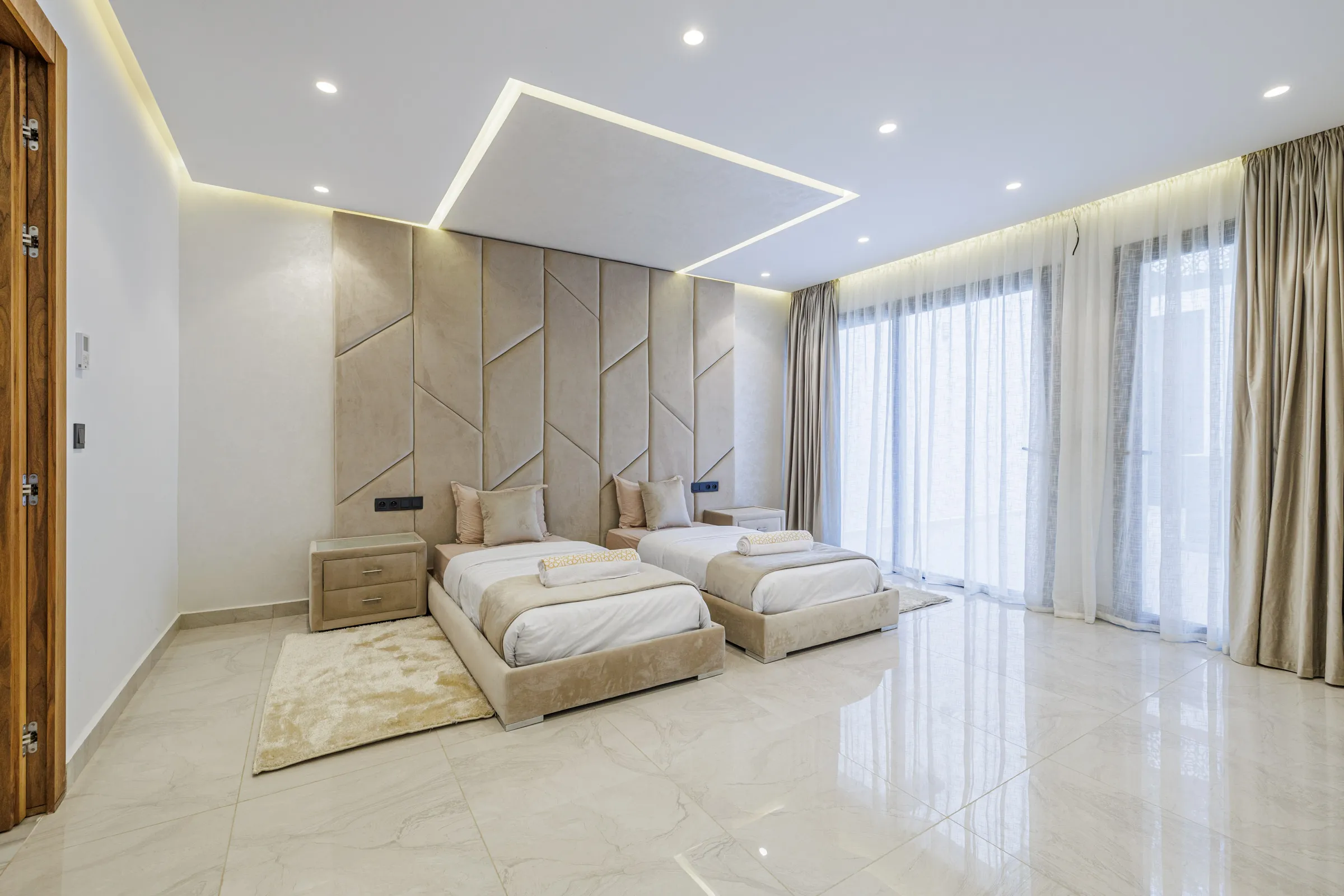 Villa Nefeli, private villa rental at Amelkis Golf, Marrakech: twin bedroom with padded wall panels