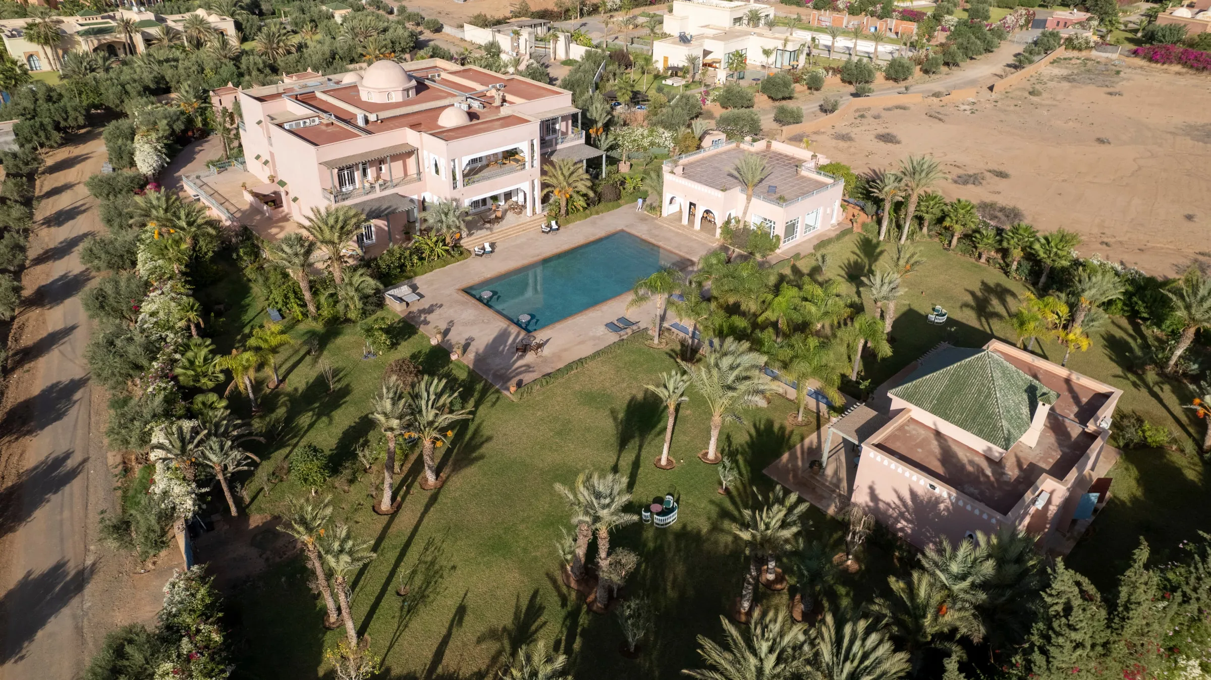 Villa Nyx, private villa rental on the Route d'Amizmiz, Marrakech: aerial view of the gardens and pool
