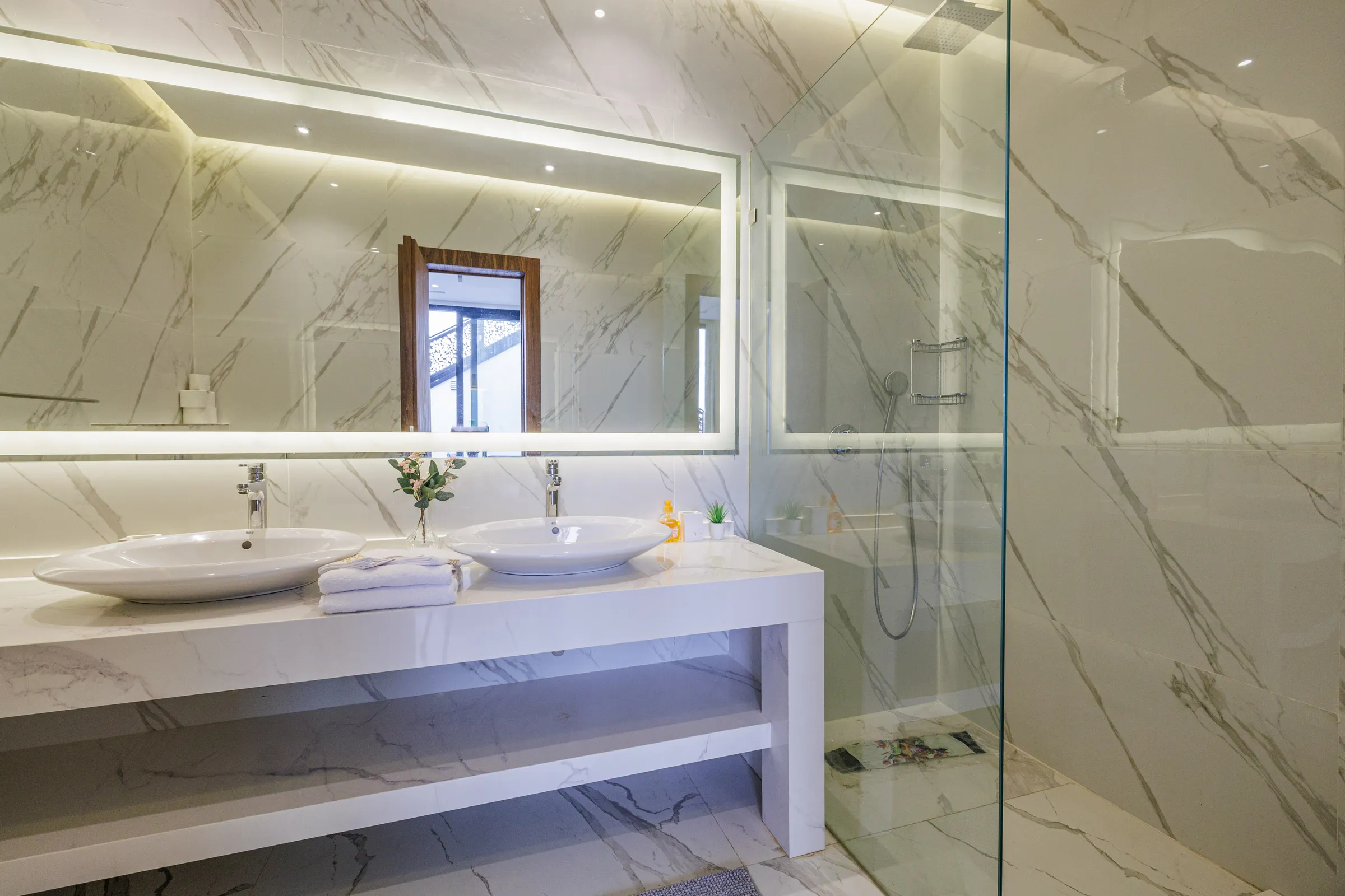 Villa Nefeli, private villa rental at Amelkis Golf, Marrakech: white marble bathroom with double vanity