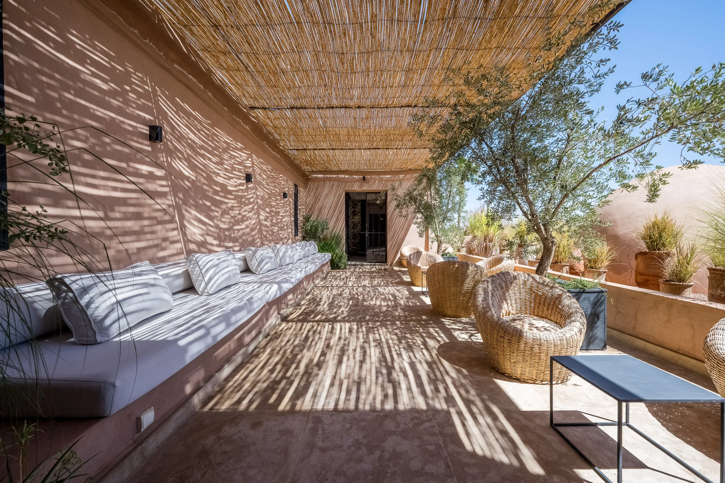 Villa Elara, private villa rental on the Route de Ouarzazate, Marrakech: shaded lounge under a reed pergola