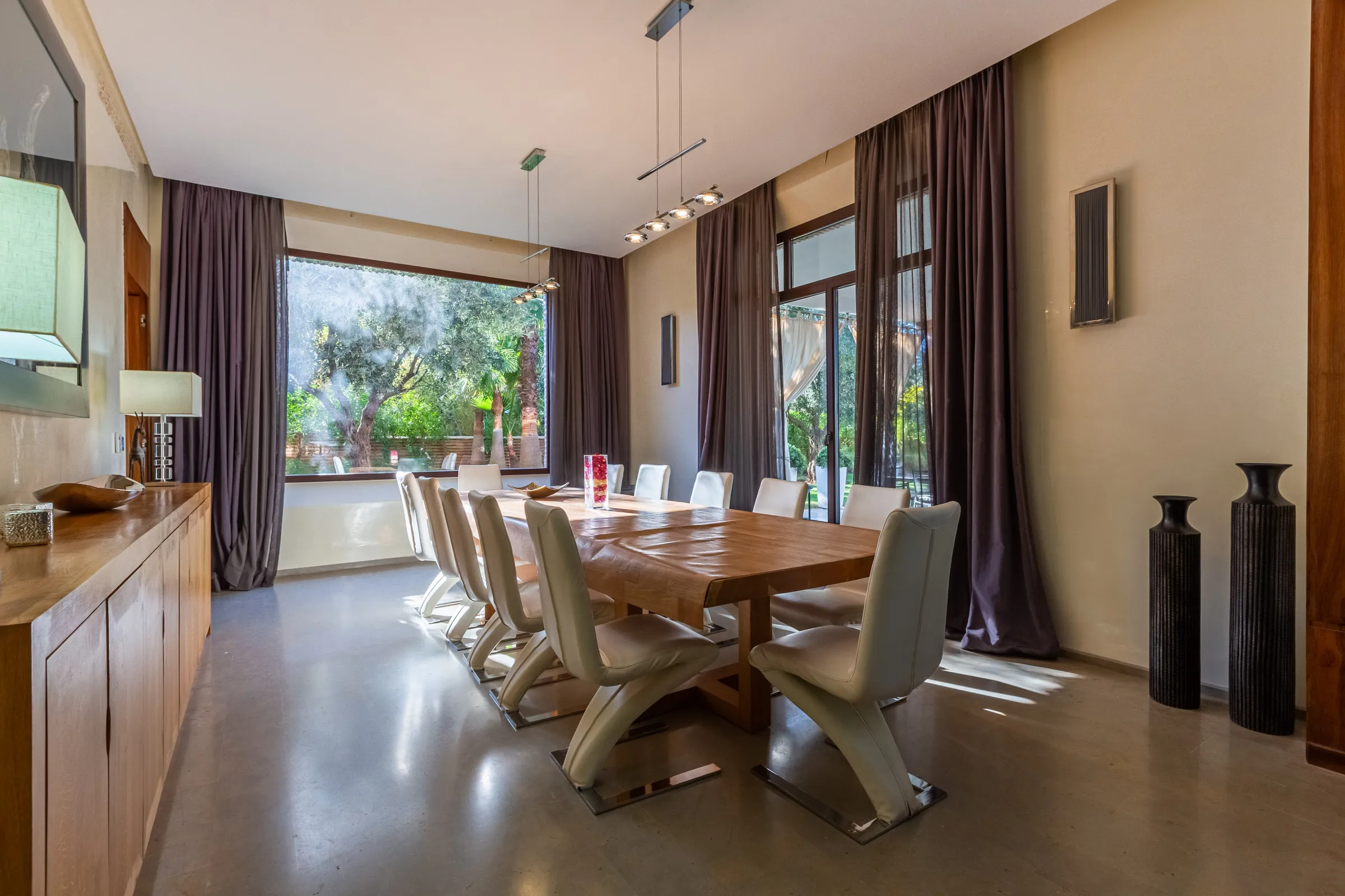 Villa Ismene, private villa rental at Samanah Golf, Marrakech: dining room with a long wooden table