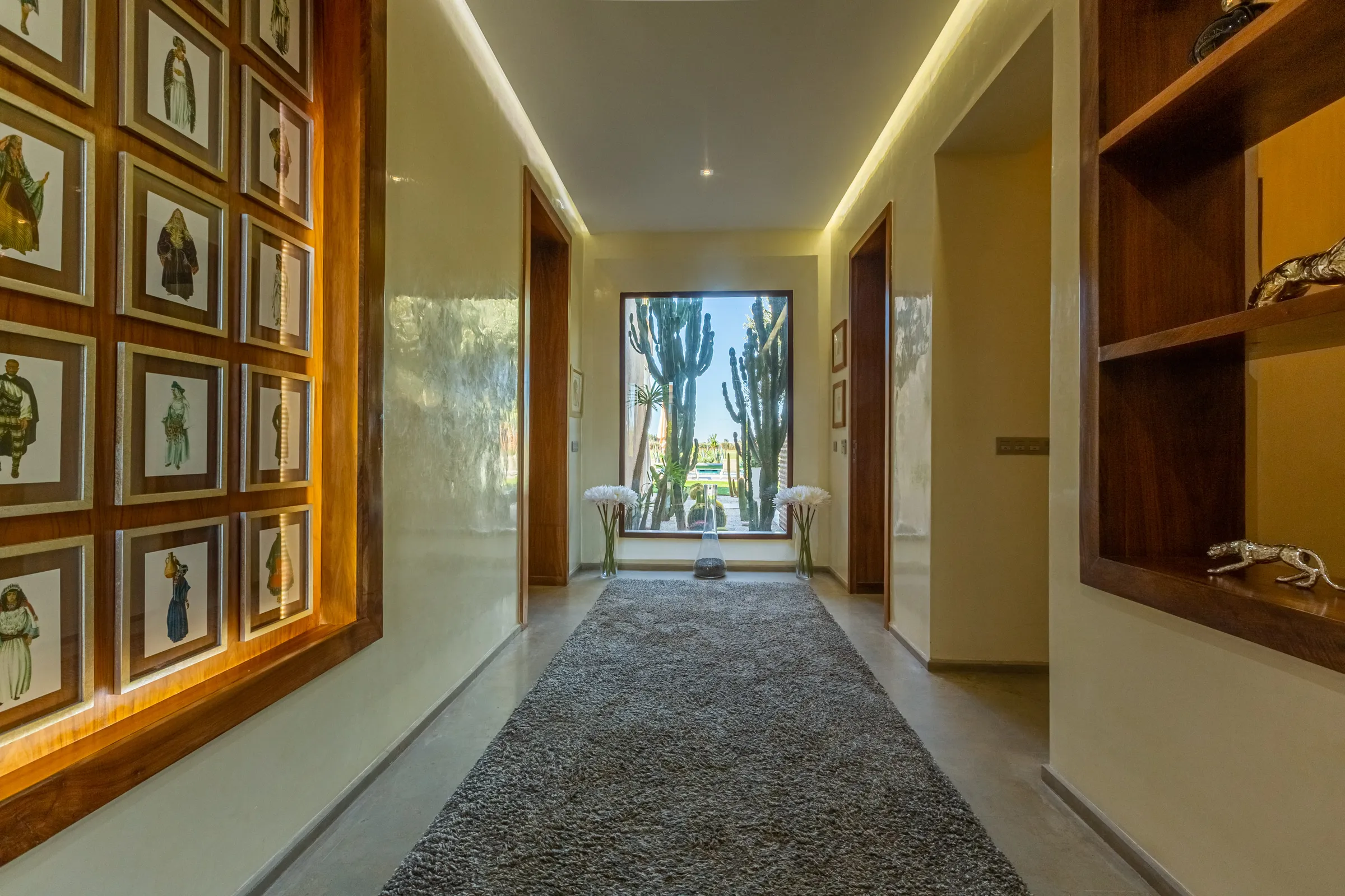 Villa Ismene, private villa rental at Samanah Golf, Marrakech: hallway with framed prints