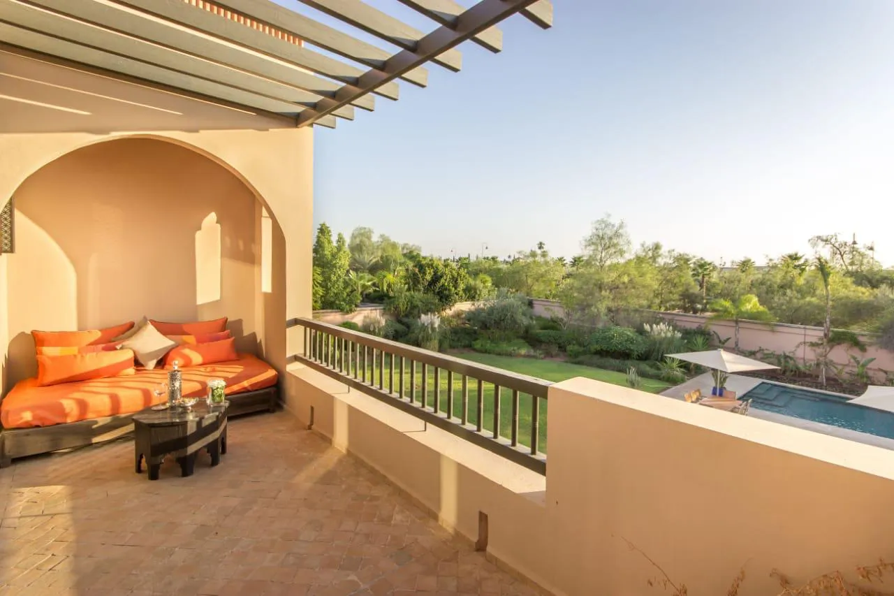Villa Kyma, private villa rental at the Four Seasons Resort, Marrakech: upper terrace lounge overlooking the garden and pool