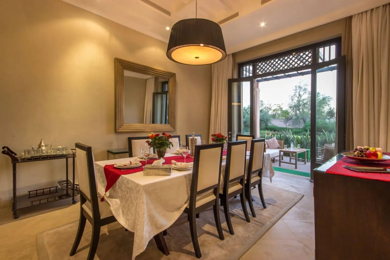 Villa Kyma, private villa rental at the Four Seasons Resort, Marrakech: dining room opening onto the garden