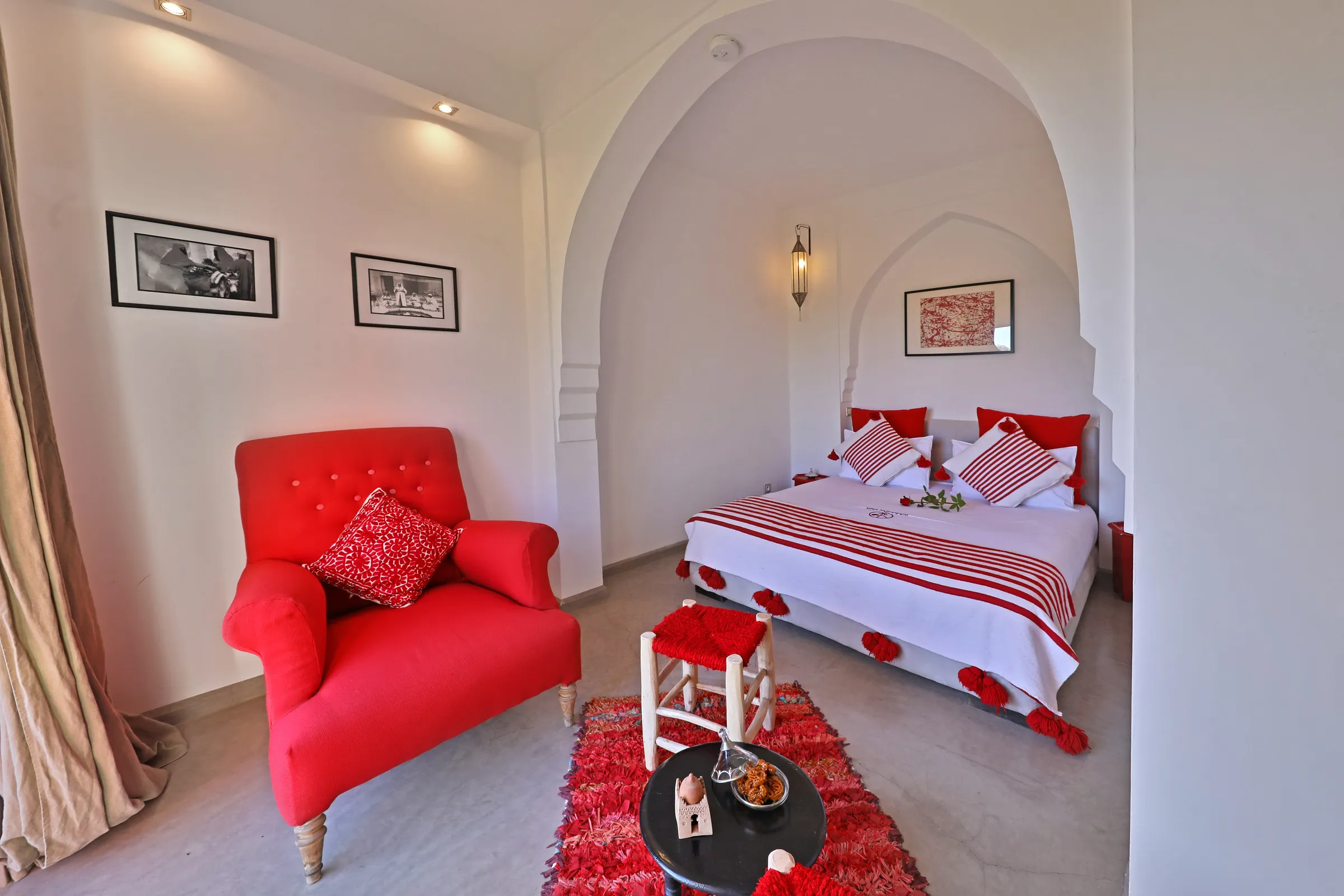 Villa Iliana, private villa rental on the Route de l'Ourika, Marrakech: red and white bedroom with armchair