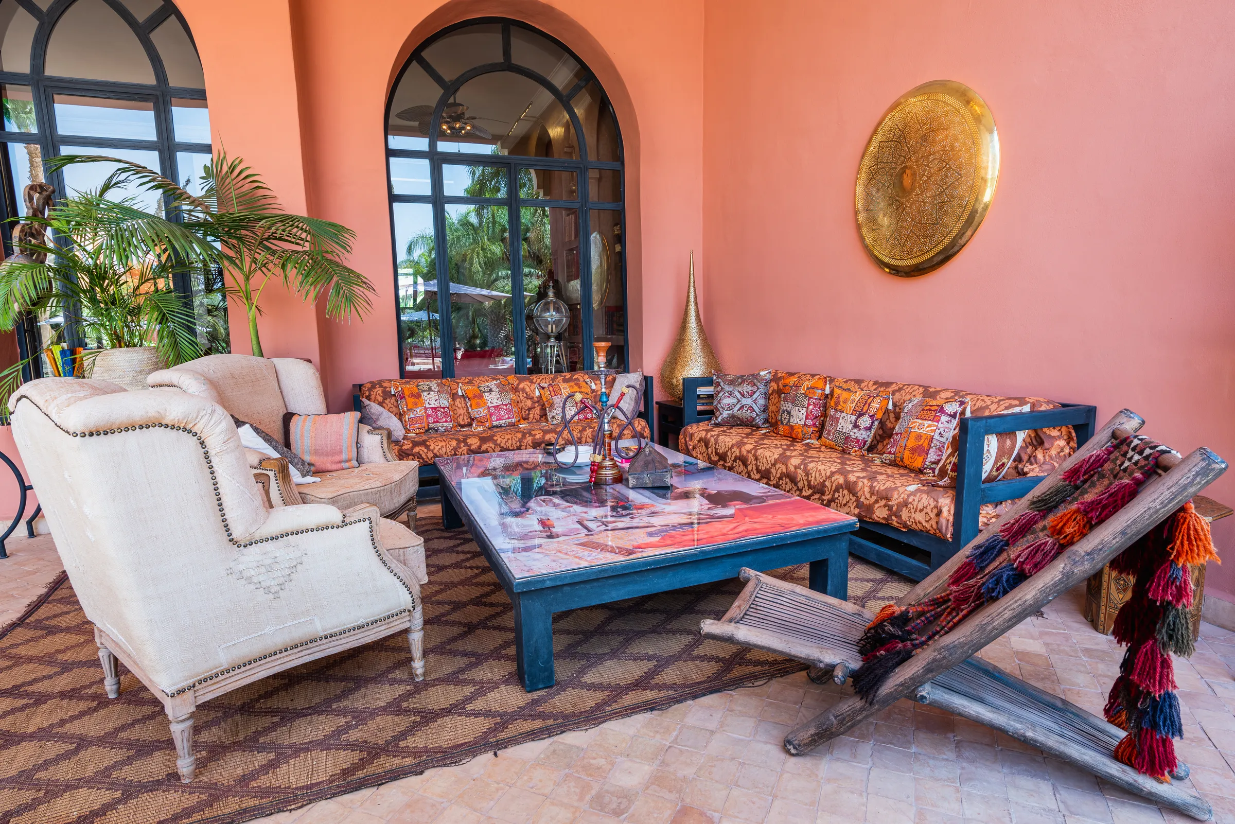 Villa Lyra, private villa rental in Ouled Hassoune, Marrakech: covered terrace lounge with sofas