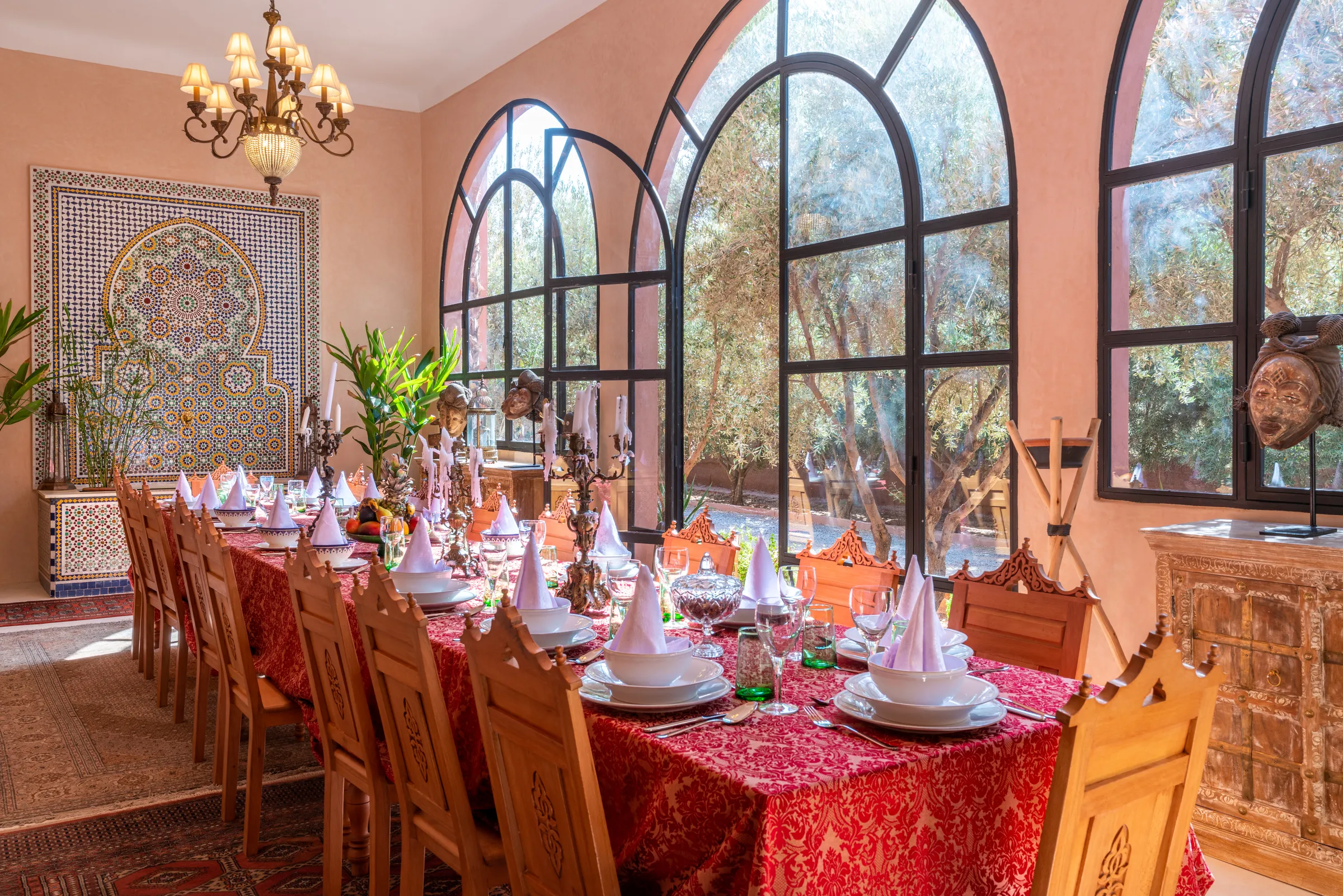 Villa Lyra, private villa rental in Ouled Hassoune, Marrakech: dining room with long table and arched windows