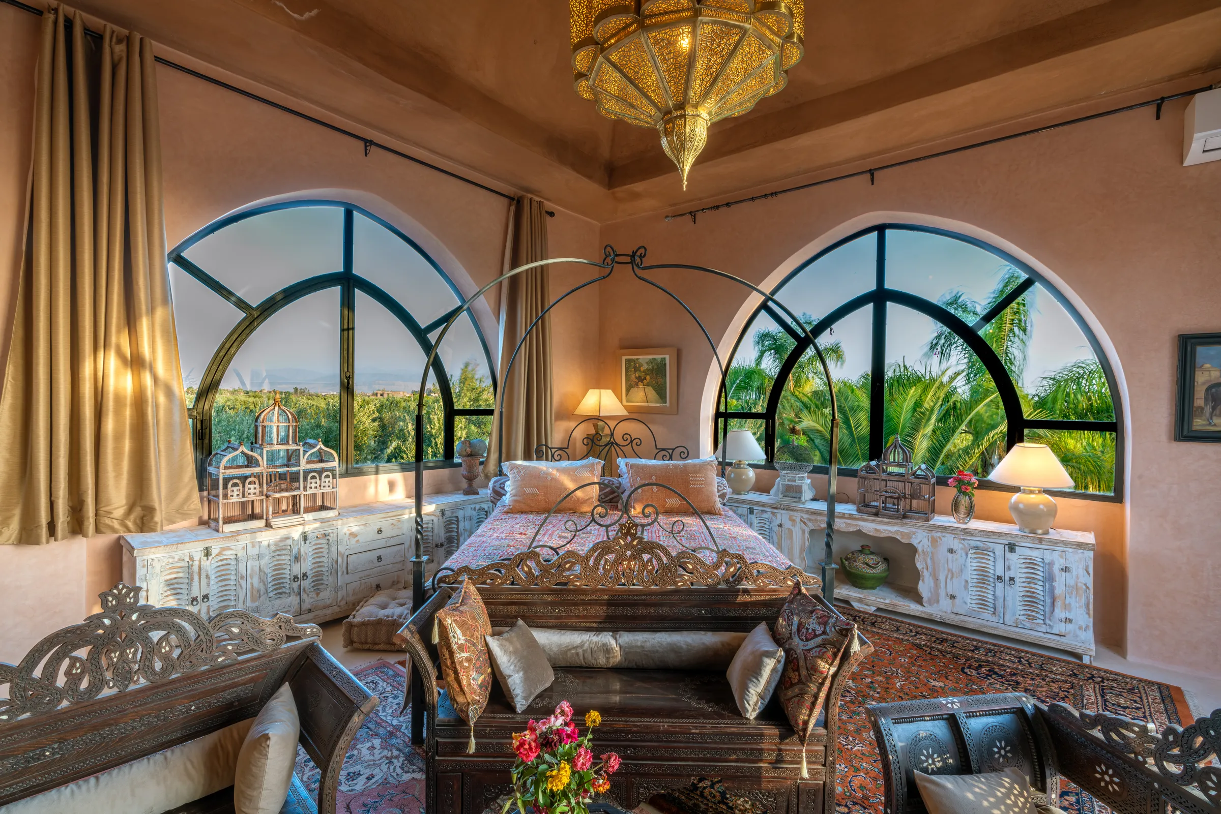 Villa Lyra, private villa rental in Ouled Hassoune, Marrakech: suite with iron canopy bed and arched windows