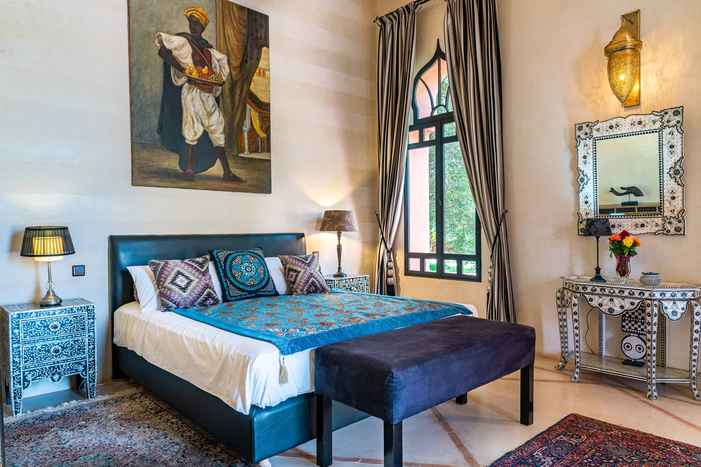 Villa Lyra, private villa rental in Ouled Hassoune, Marrakech: bedroom with blue bedspread and painting