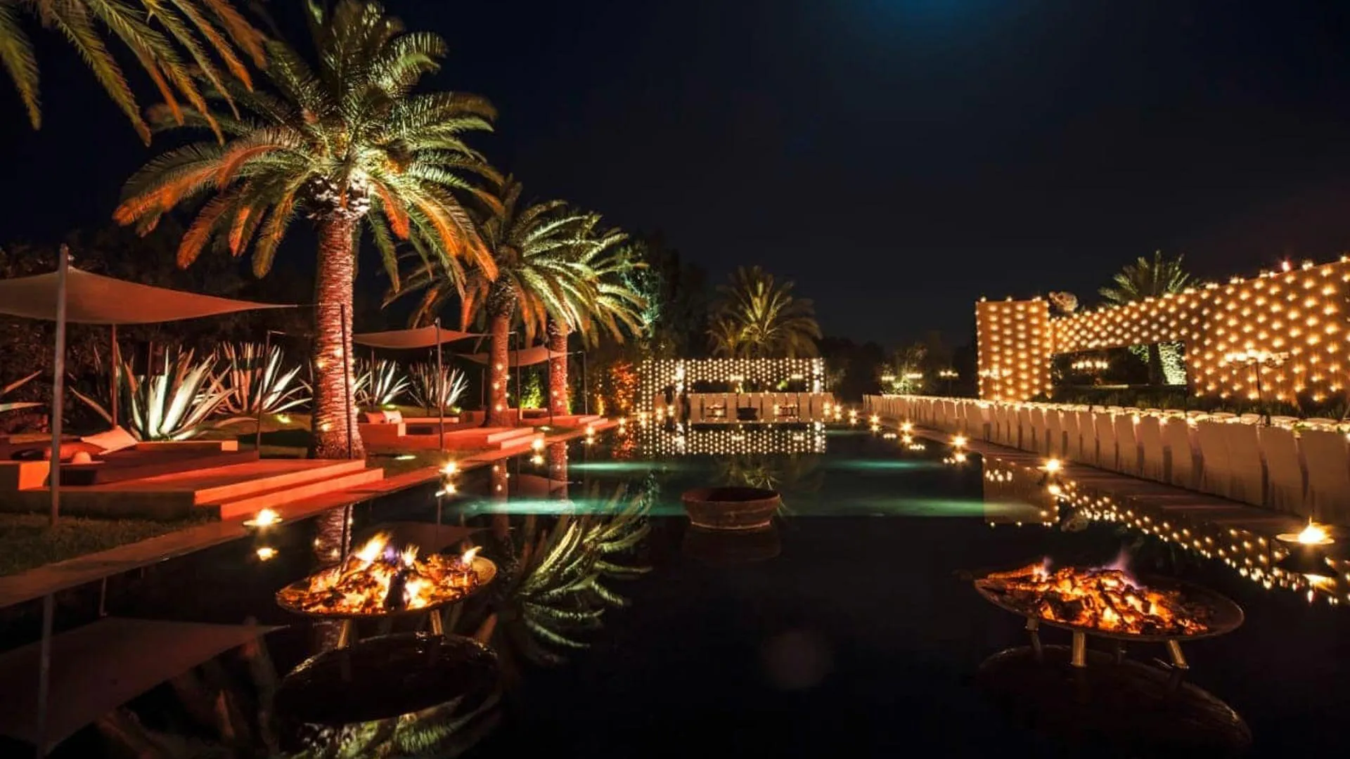Villa Phaedra, private estate rental in Ouled Hassoune, Marrakech: pool lit with lanterns at night