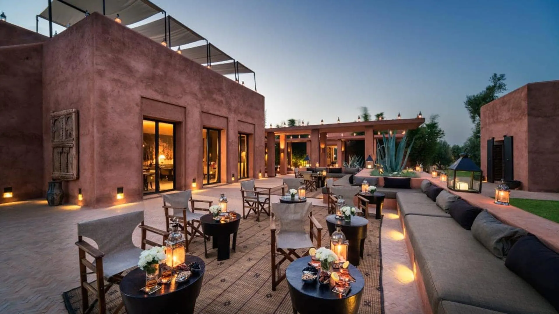 Villa Phaedra, private estate rental in Ouled Hassoune, Marrakech: terrace lounge at dusk