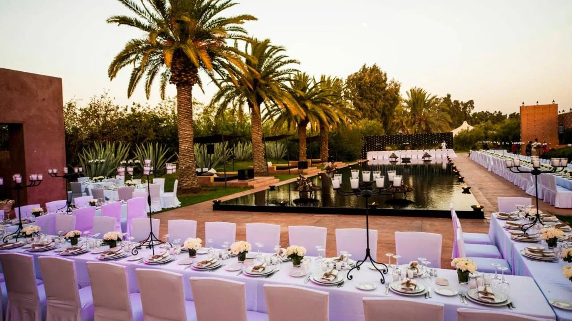 Villa Phaedra, private estate rental in Ouled Hassoune, Marrakech: dinner table set by the pool