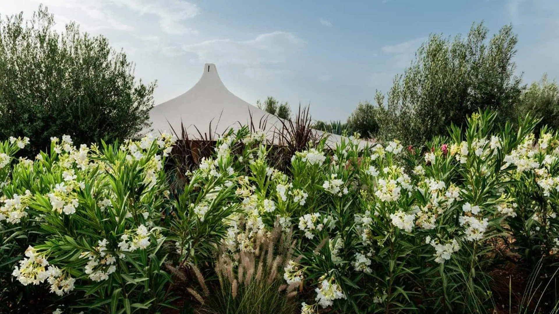 Villa Phaedra, private estate rental in Ouled Hassoune, Marrakech: flowering garden and pavilion