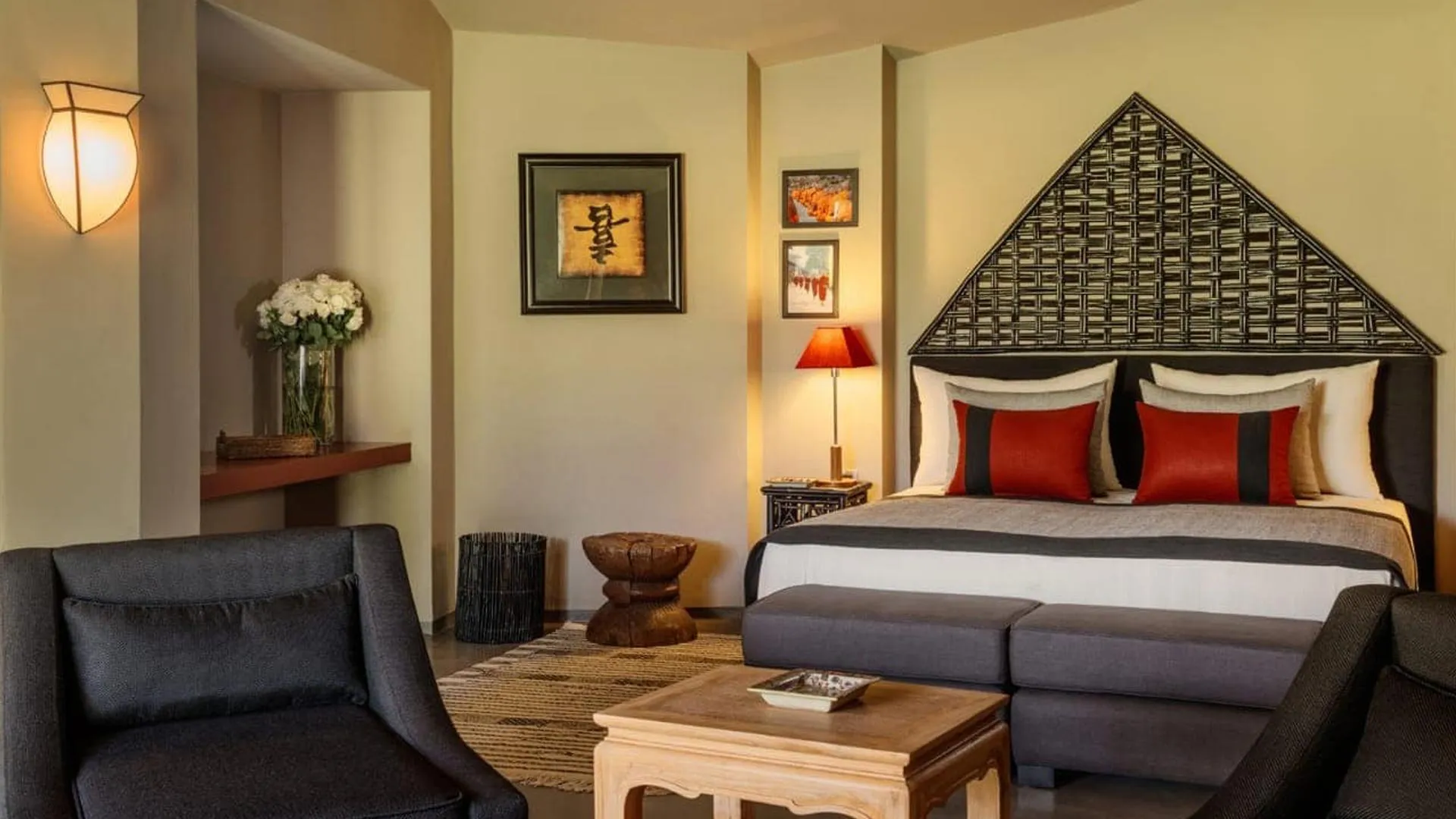 Villa Phaedra, private estate rental in Ouled Hassoune, Marrakech: bedroom with red cushions