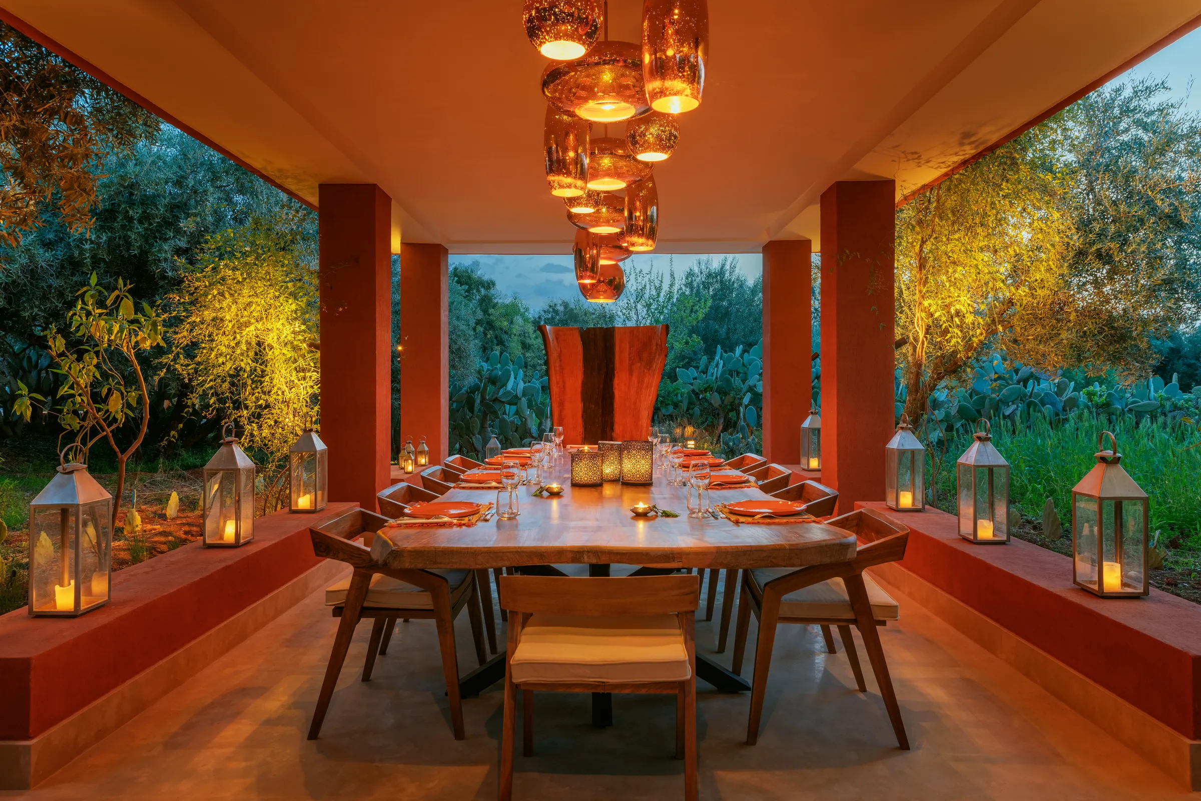 Villa Hera, private estate rental in the Ourika Valley near Marrakech: outdoor dining pavilion lit with lanterns