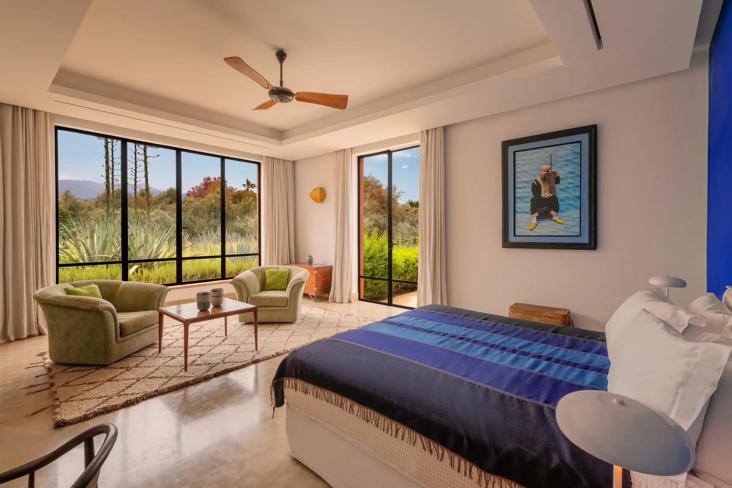 Villa Hera, private estate rental in the Ourika Valley near Marrakech: blue suite opening onto the garden