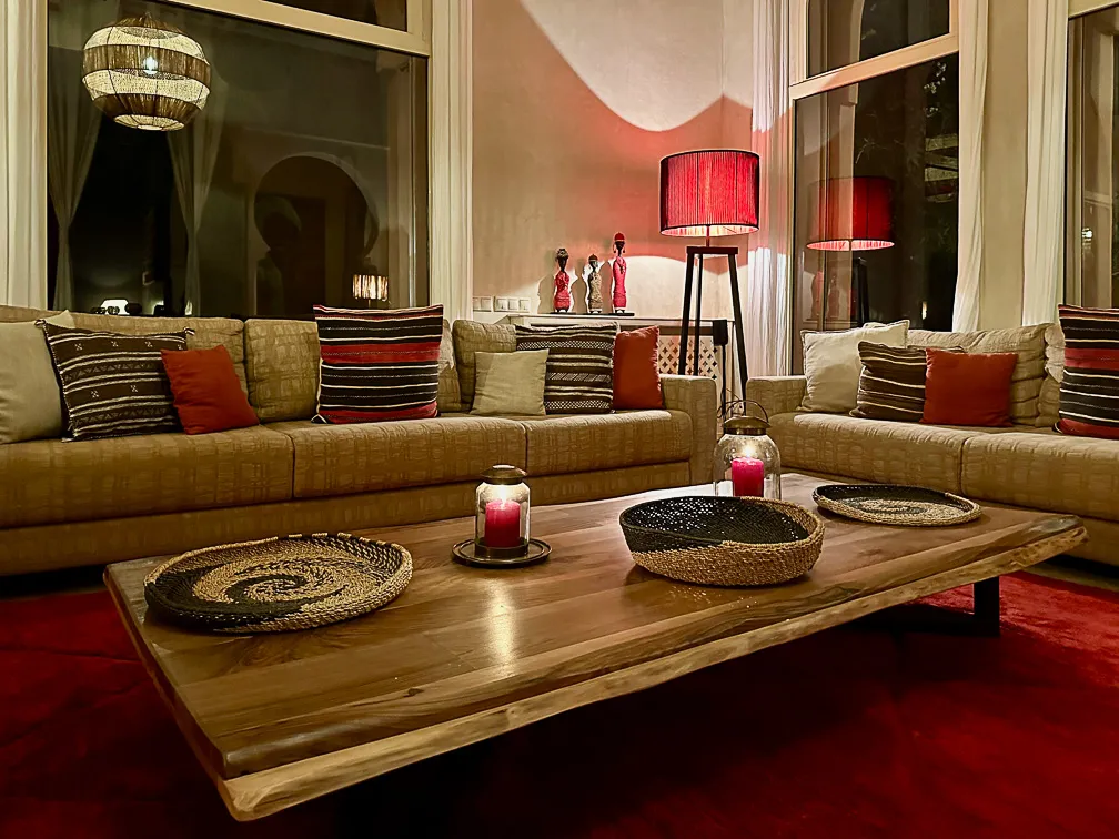 Villa Danae, private villa rental in Sidi Abdellah Ghiat, Marrakech: lounge with red rug and wooden coffee table
