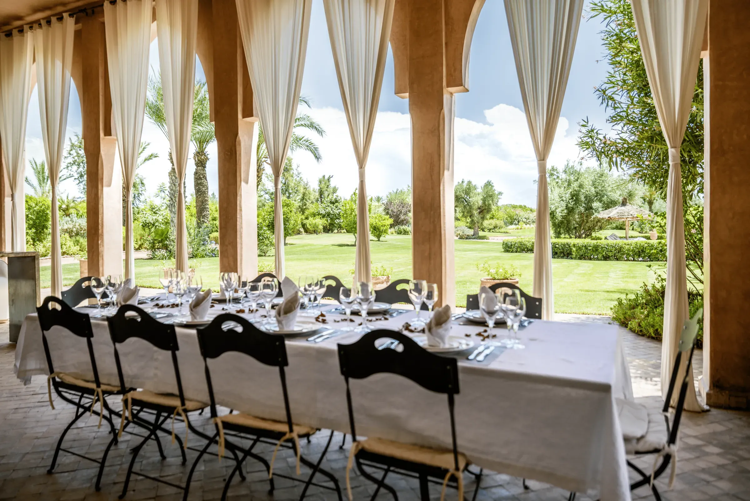 Villa Danae, private villa rental in Sidi Abdellah Ghiat, Marrakech: outdoor dining under the arcade