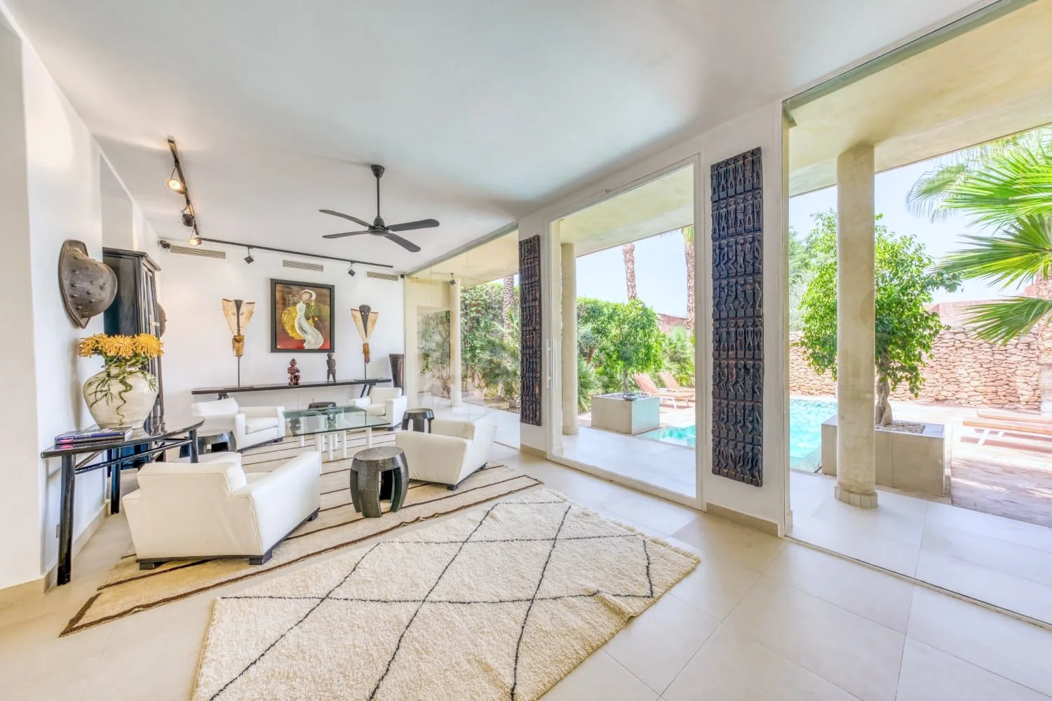 Villa Ianthe, private villa rental in the Palmeraie, Marrakech: bright living room opening onto the pool