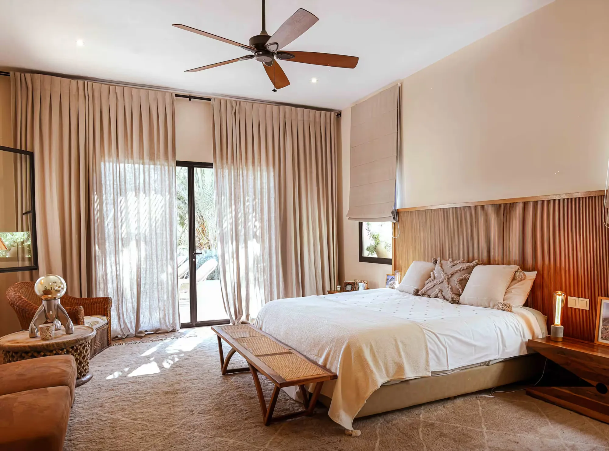 Villa Selene, private villa rental on the Route d'Amizmiz, Marrakech: bedroom with ceiling fan and garden-facing windows