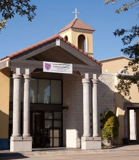 Santa Clara of Assisi Catholic Academy building exterior with cross