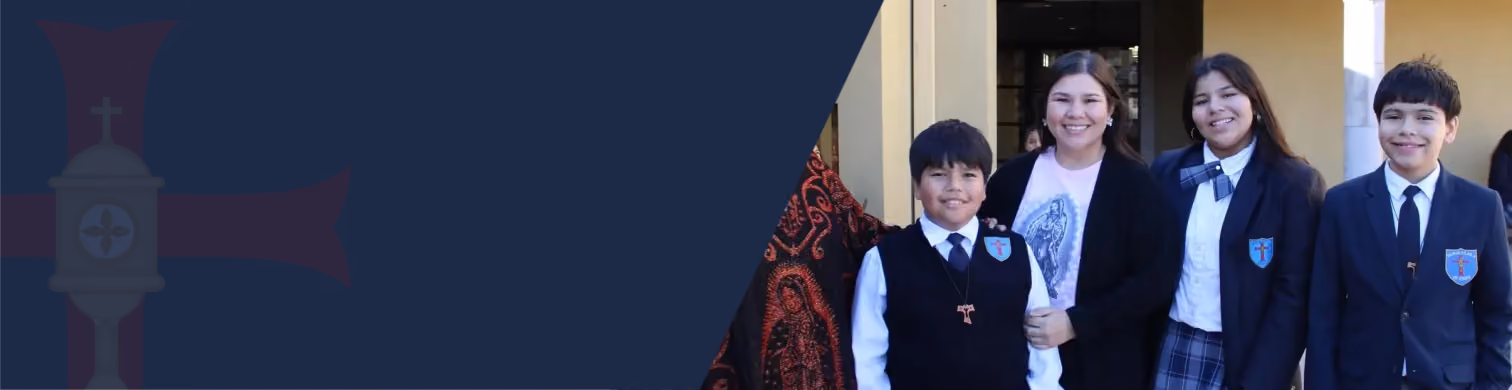 Four smiling students in school uniforms posing together outside