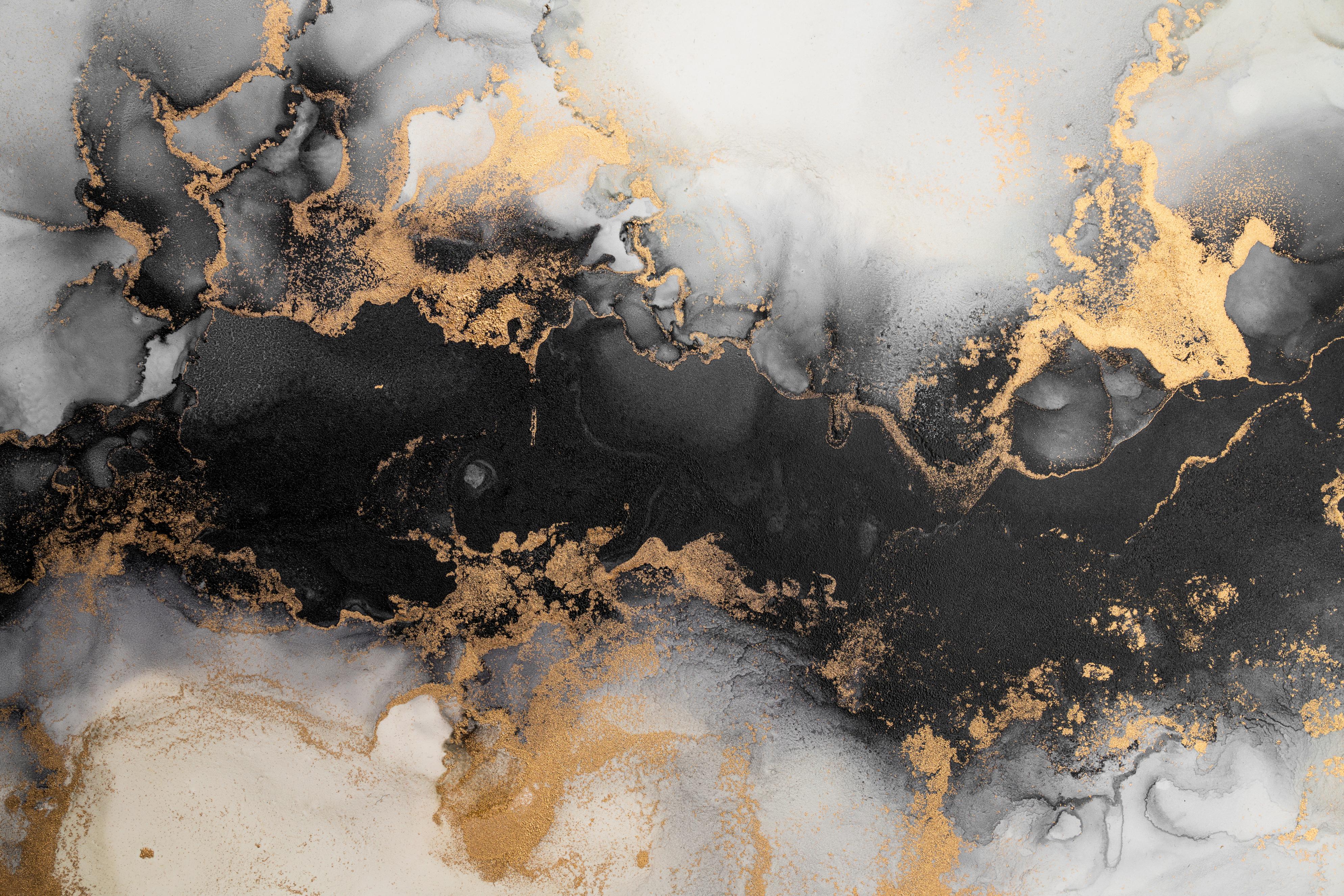 Abstract ink art with black, gray, white, and gold metallic fluid patterns blending and swirling.