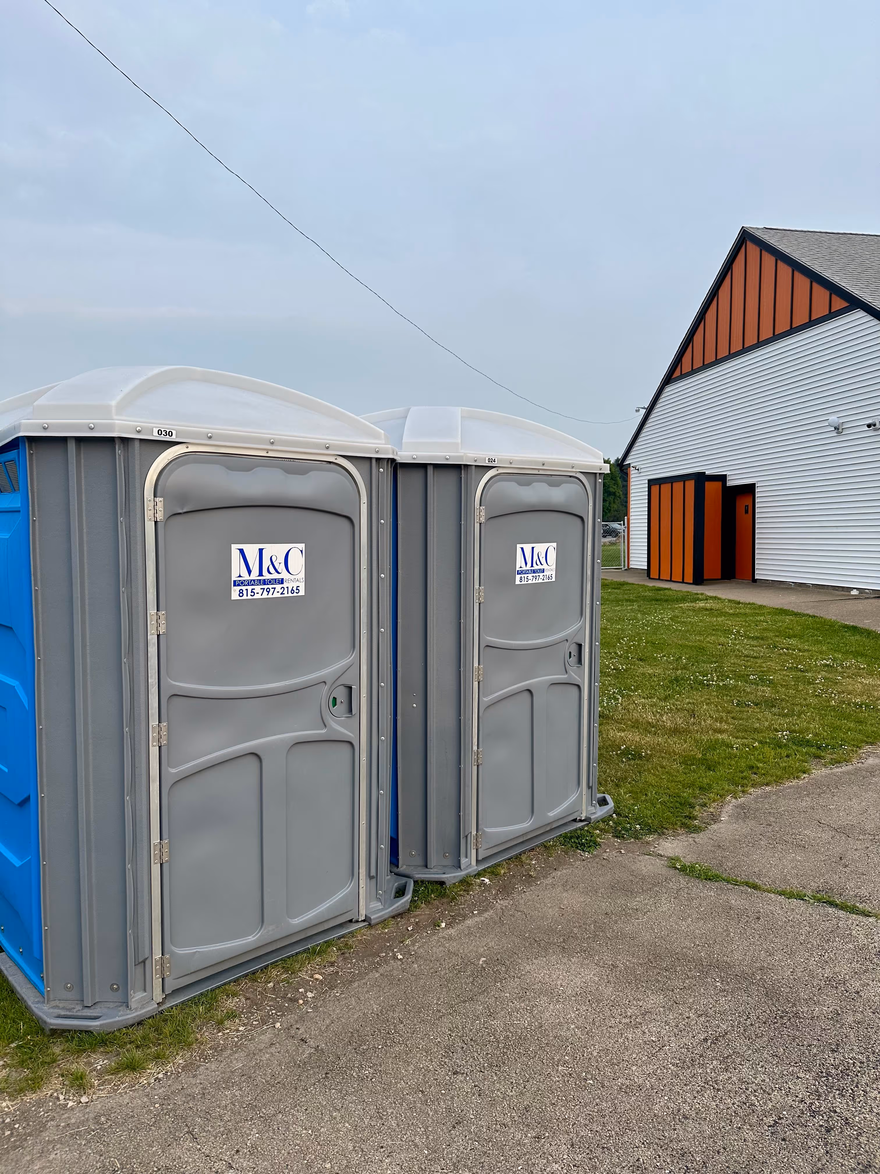 2-gray-porta-potties-for-m-and-c-rentals