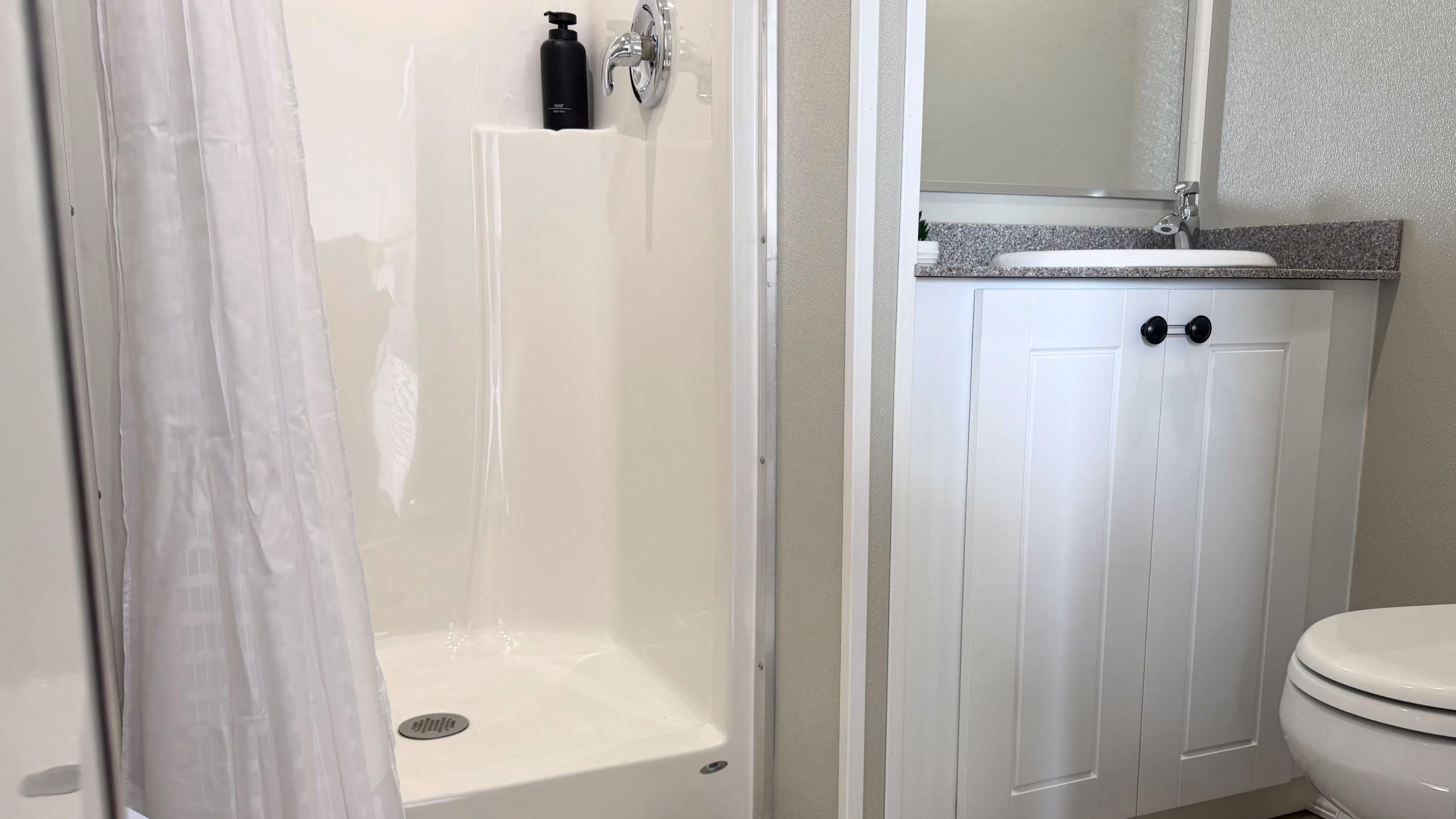 shower-vanity-and-toilet-in-trailer
