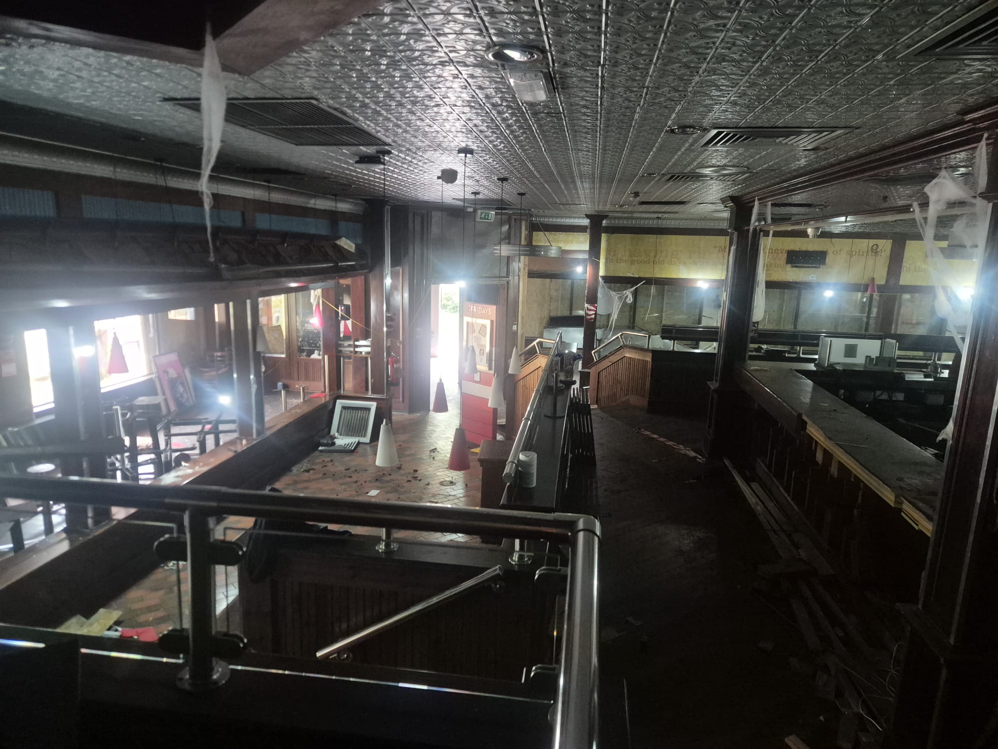 Site set up with Heras fencing at the former TGI Fridays restaurant, Cross Street, Sale