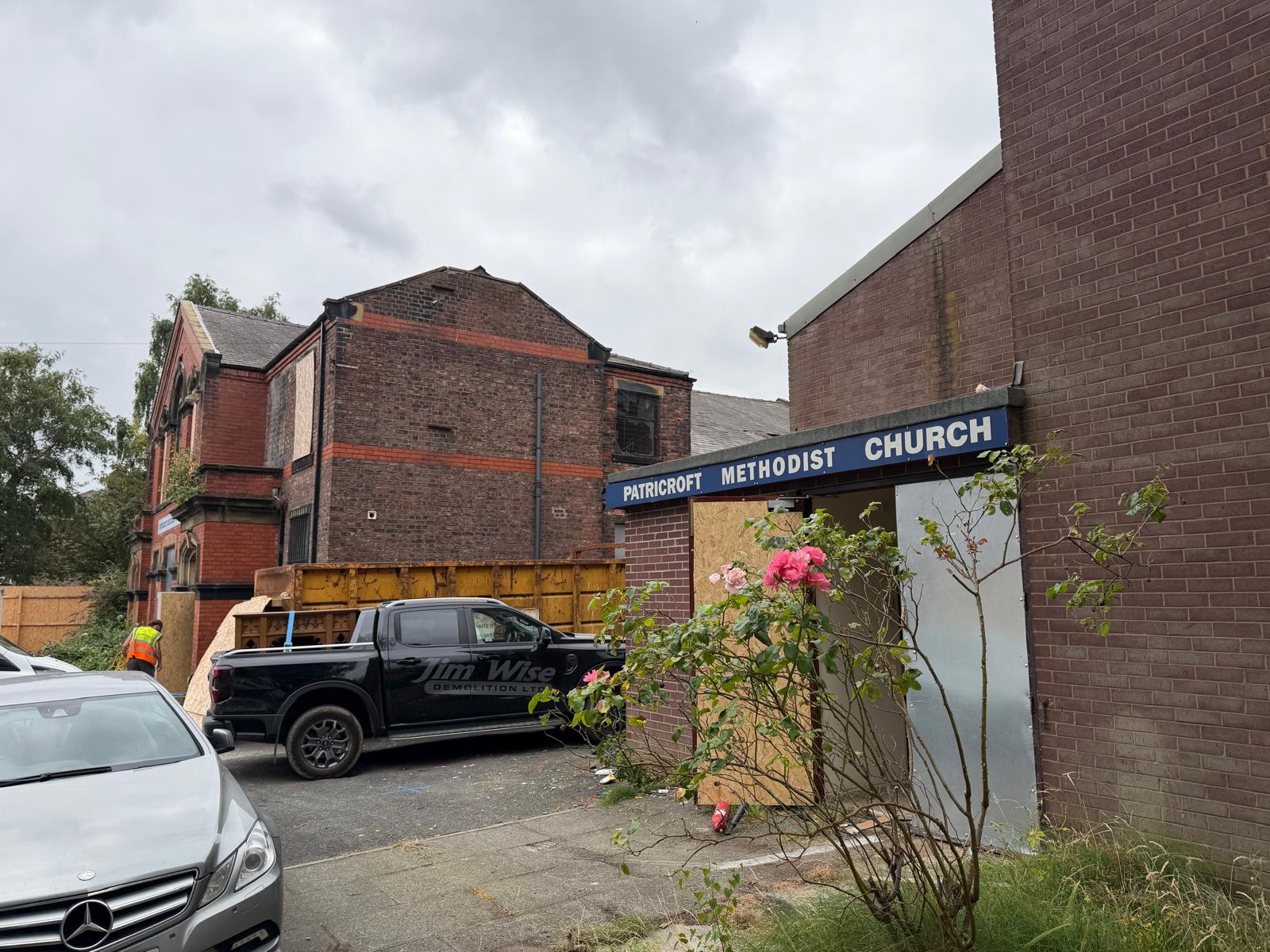 Roof tiles being stripped by hand from the former Methodist church, Eccles