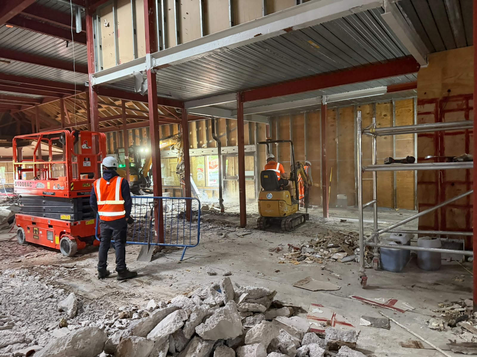 Mezzanine floor removal with mini excavators during strip out