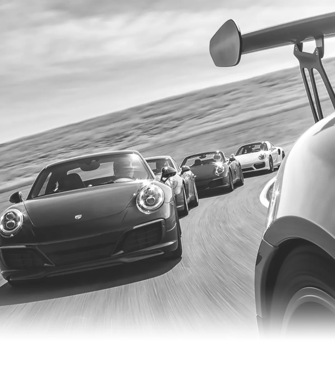 A close up view of a line of vintage racecars in hot pursuit, symbolizing active execution, momentum,  and the disciplined motion of a strategic sales process.