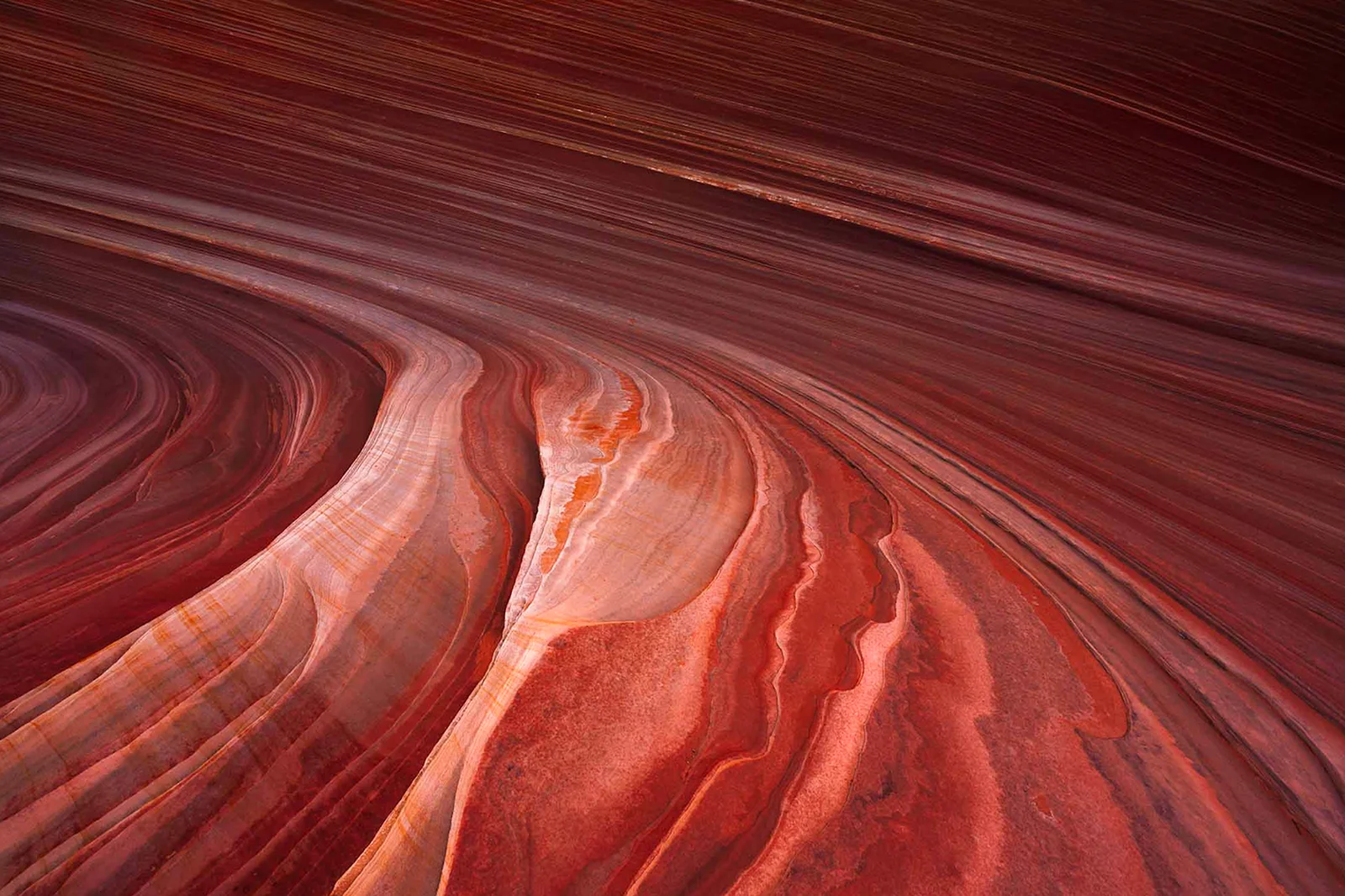 Sweeping red canyon wave formation, capturing the concept of structured yet adaptive commercial framework.