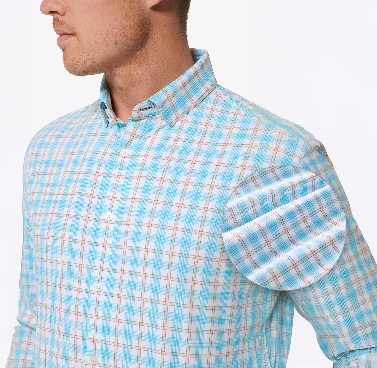 Close-up of a model wearing a blue checked button-down shirt