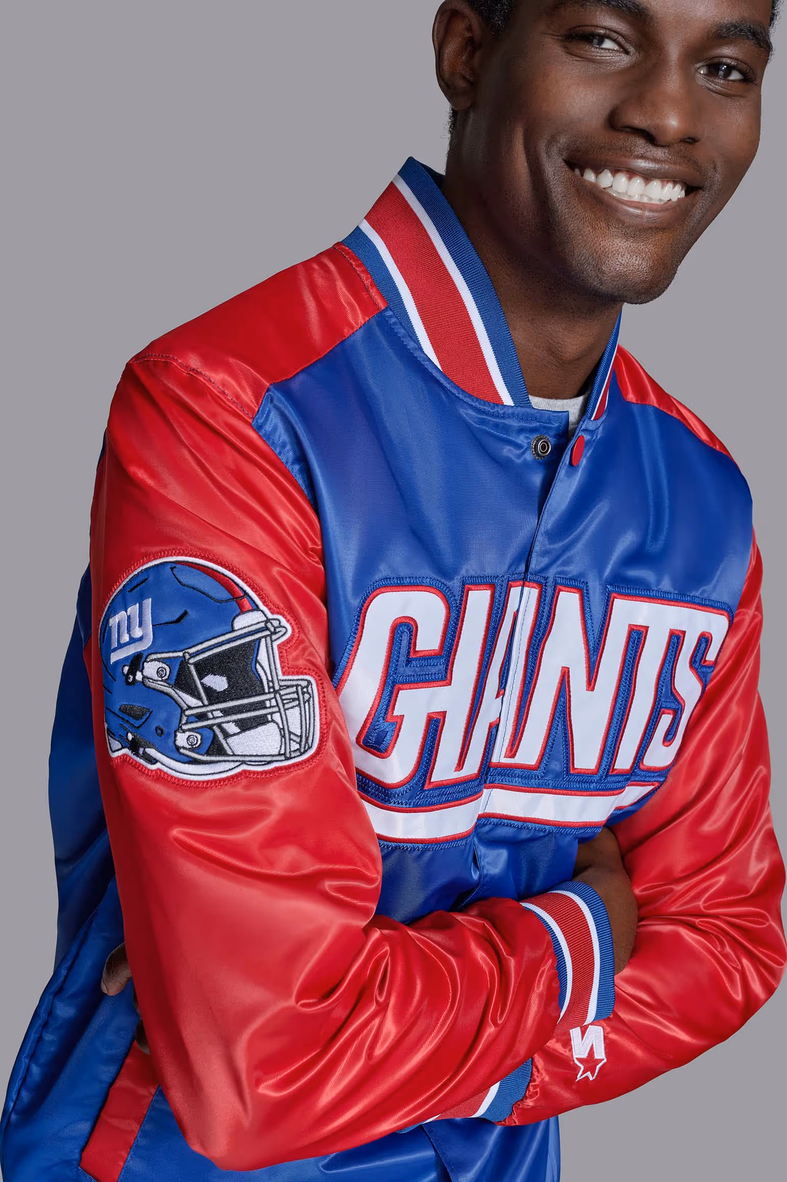 Model wearing a red and blue Giants jacket
