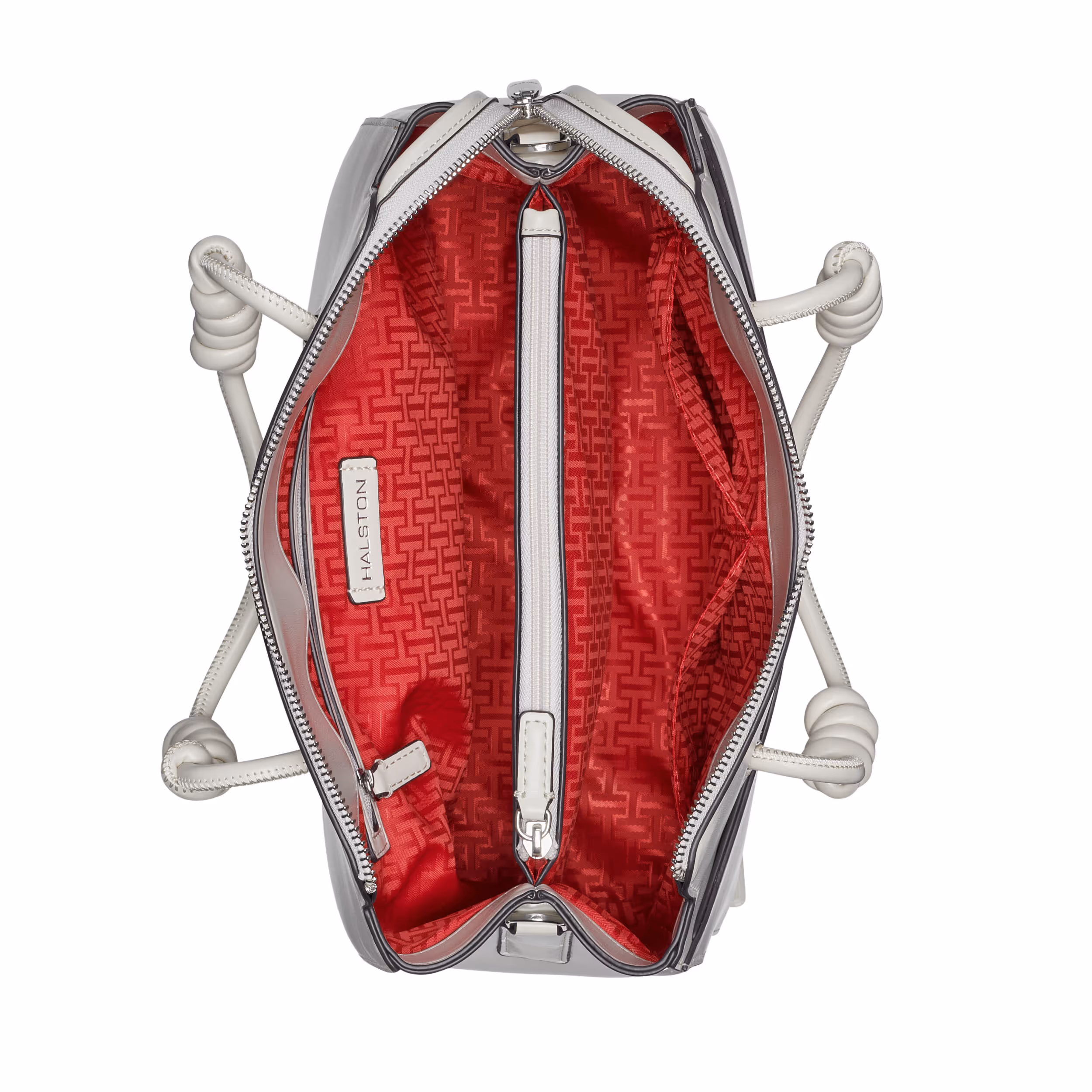 Open gray handbag showing its red lining and interior compartments