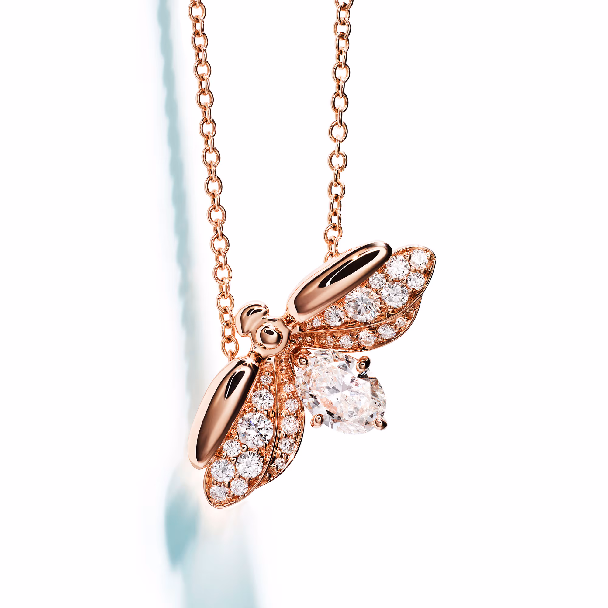 Rose-gold floral pendant set with clear stones