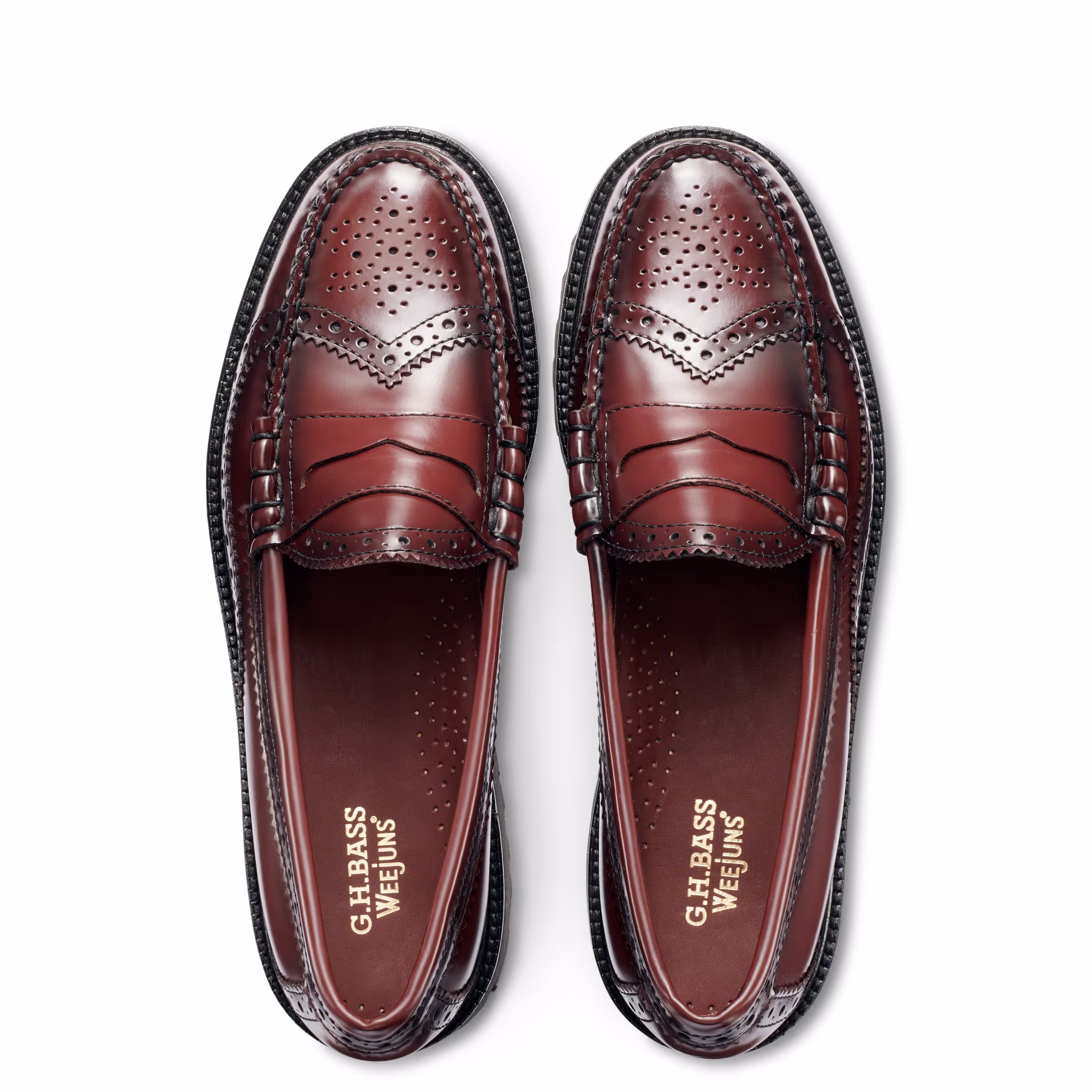 Pair of burgundy leather brogue loafers viewed from above