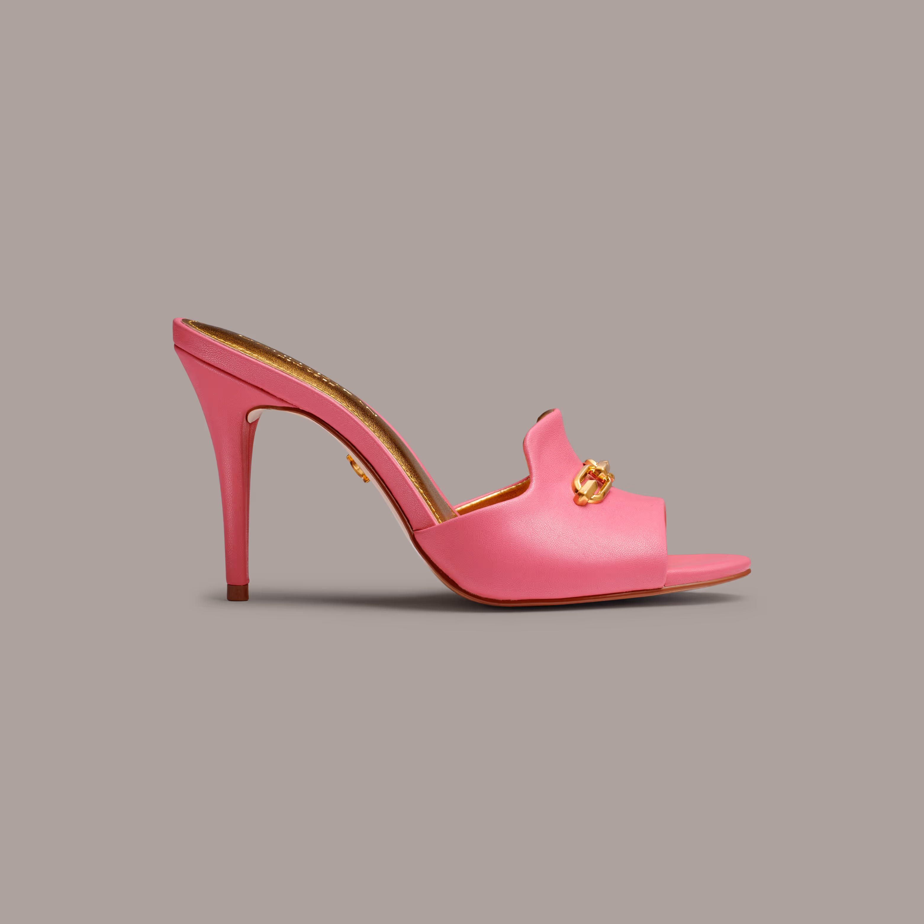 Pink open-toe mule with a gold detail