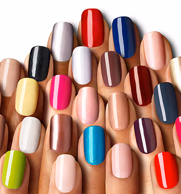 Overlapping fingertips displaying a range of nail polish shades