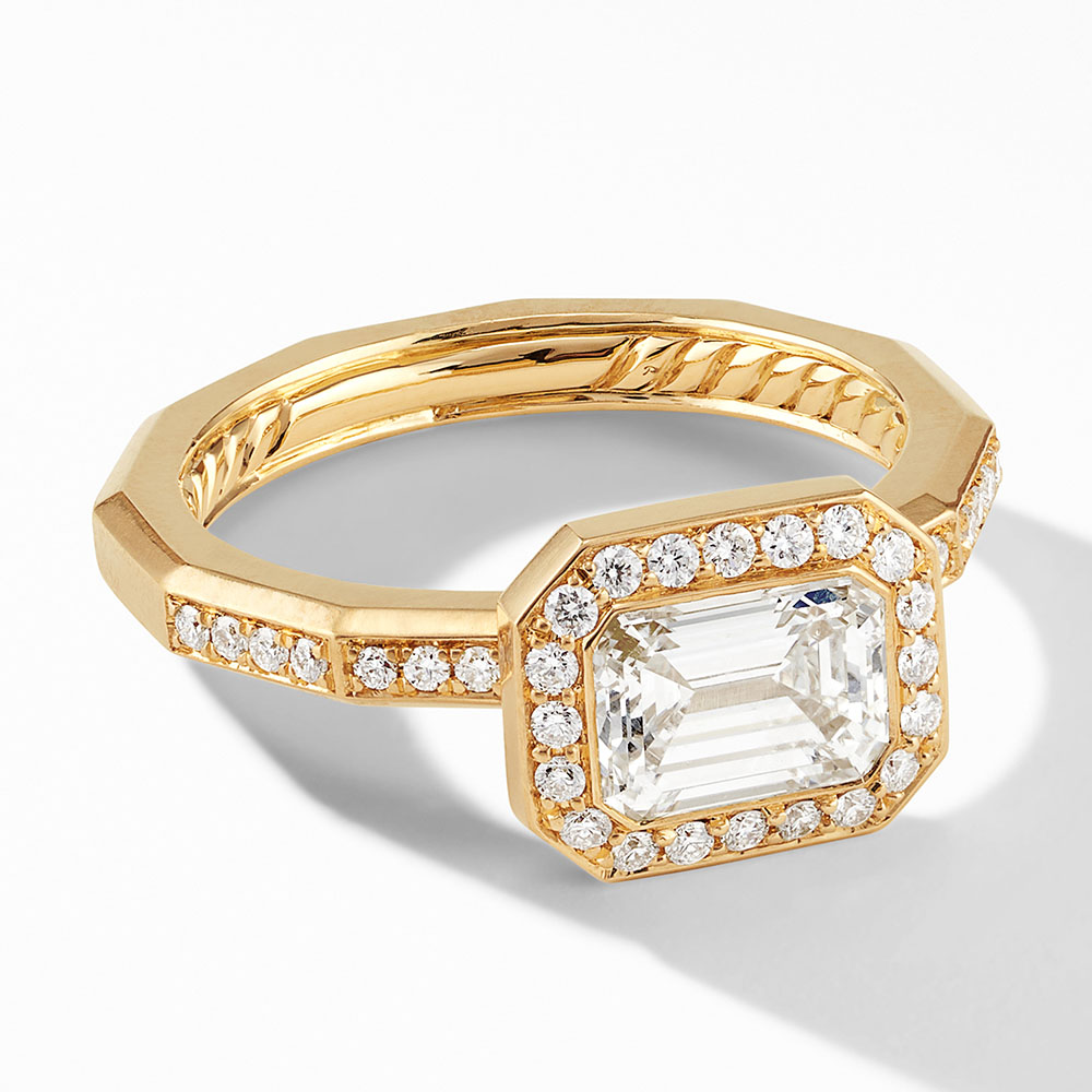Gold ring with a rectangular center stone and pavé accents