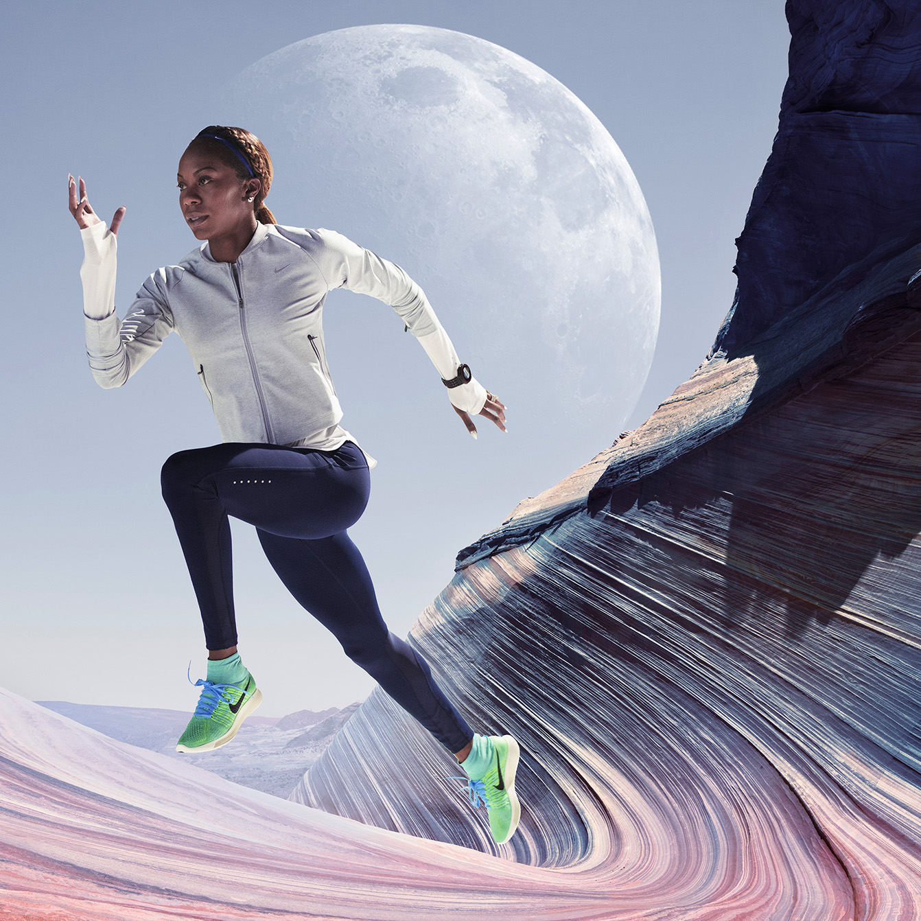 Runner composited into a colorful rocky landscape beneath a large moon