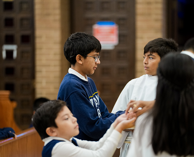 Students participating in a church prayer service together