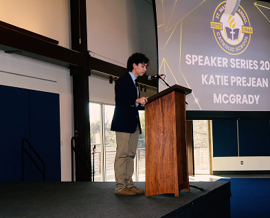 Student speaking at podium during Katie Prejean McGrady Speaker Series event