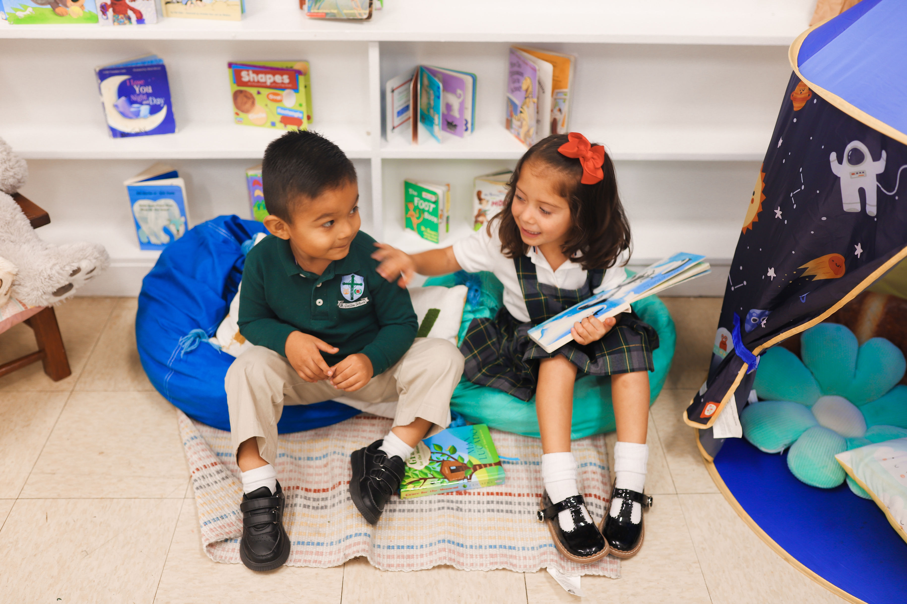 St. Cecilia Catholic School students reading books together in a classroom
