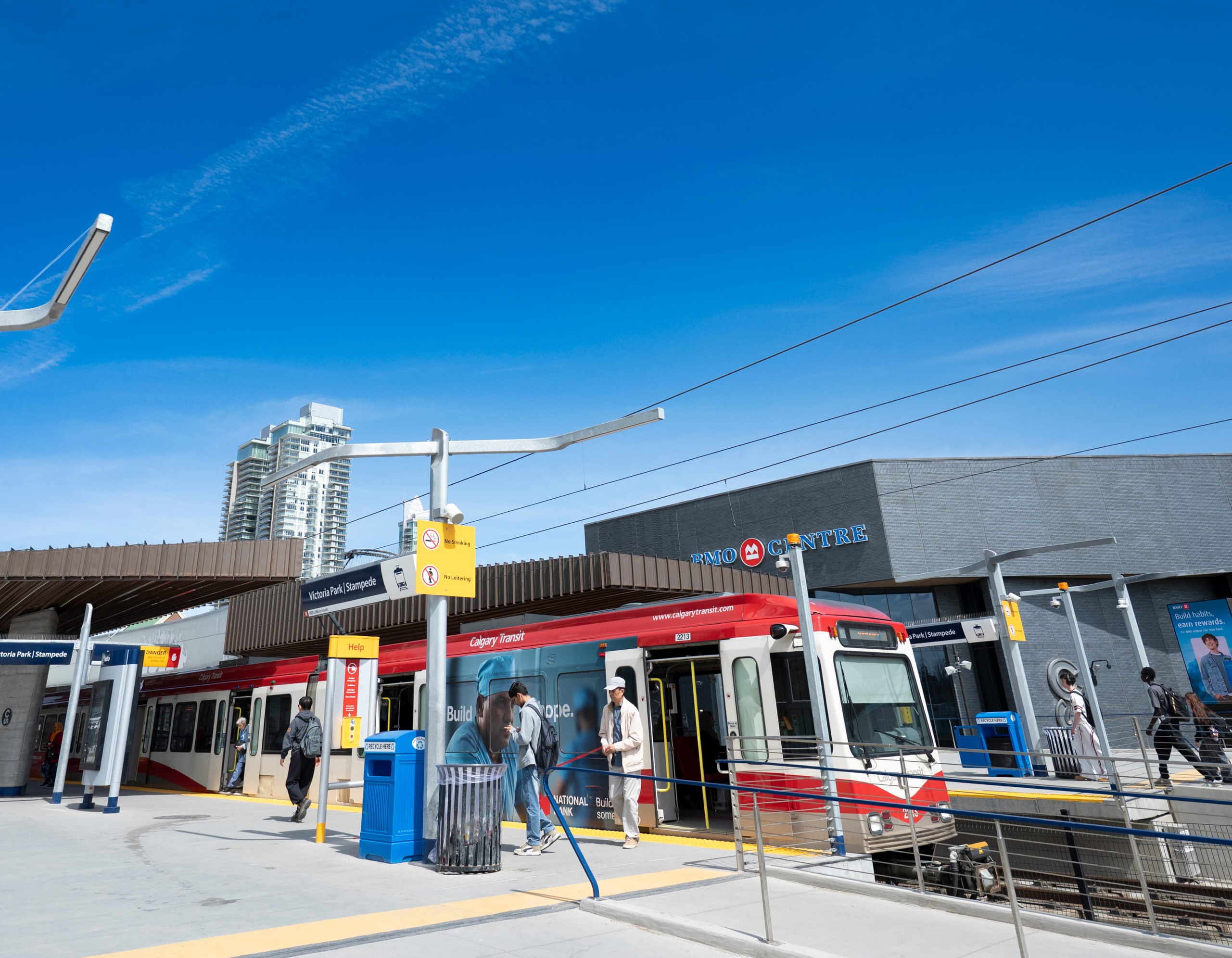 Victoria Park Stampede Calgary Transit station platform with a red shelter and Help kiosk.