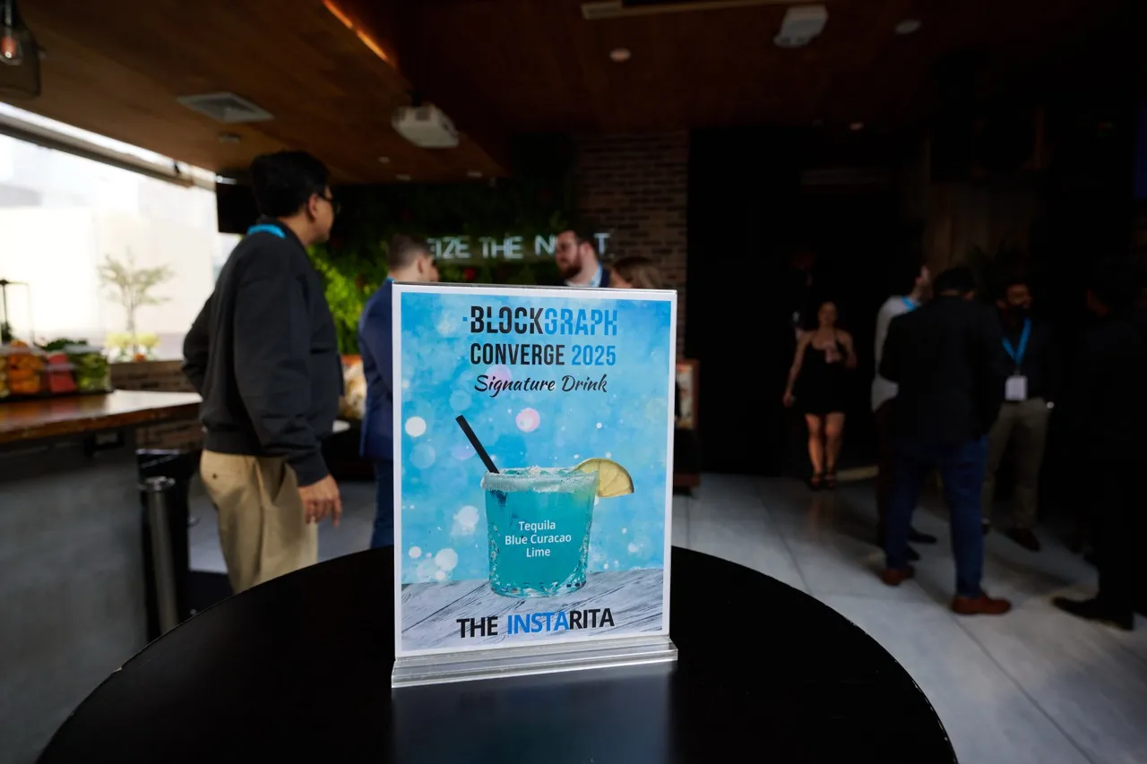 Table tent showing Blockgraph Converge 2025 signature drink, The Instarita, with ingredients tequila, blue curacao, and lime.