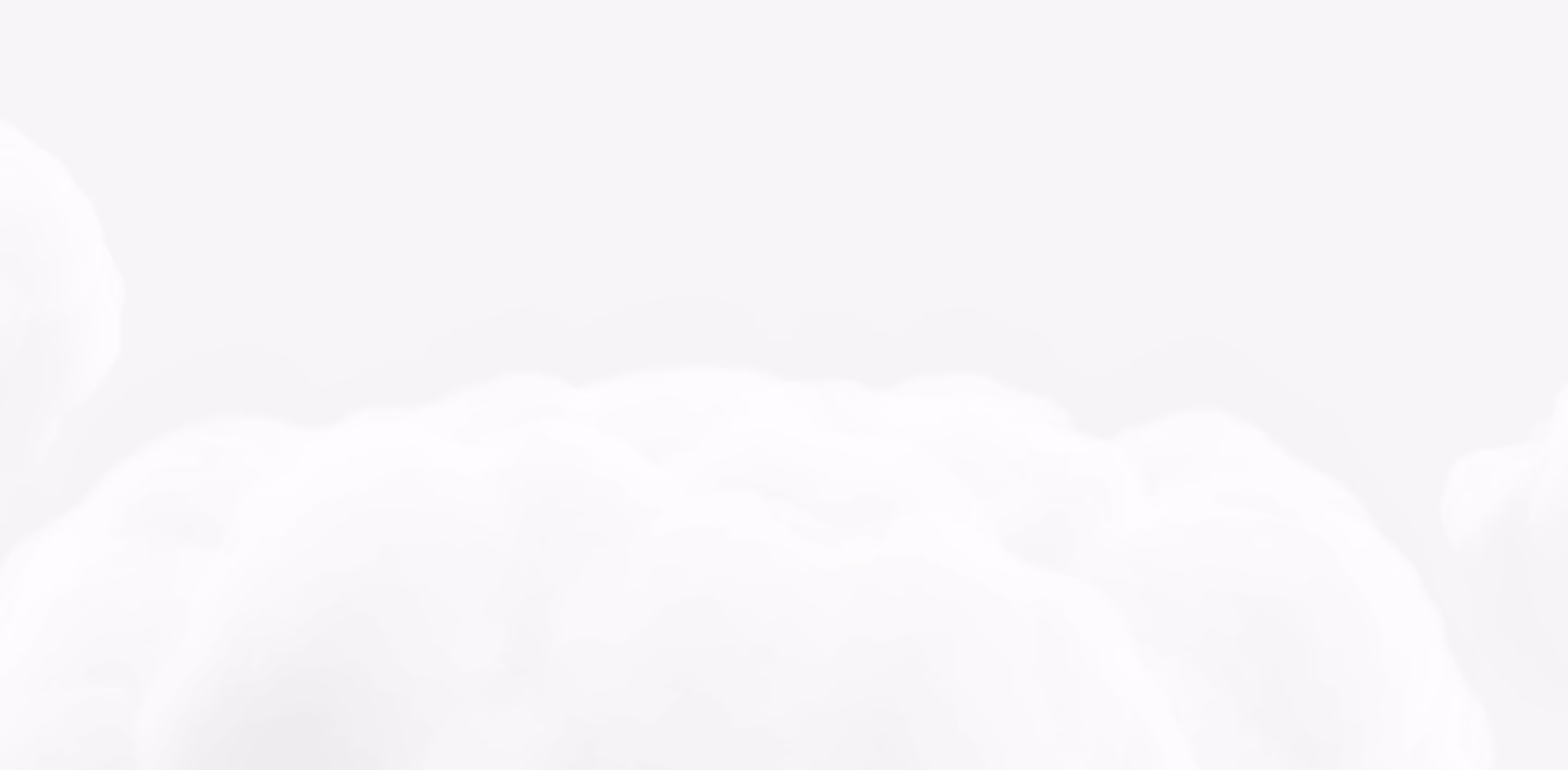 Soft, white fluffy clouds against a light gray sky background.