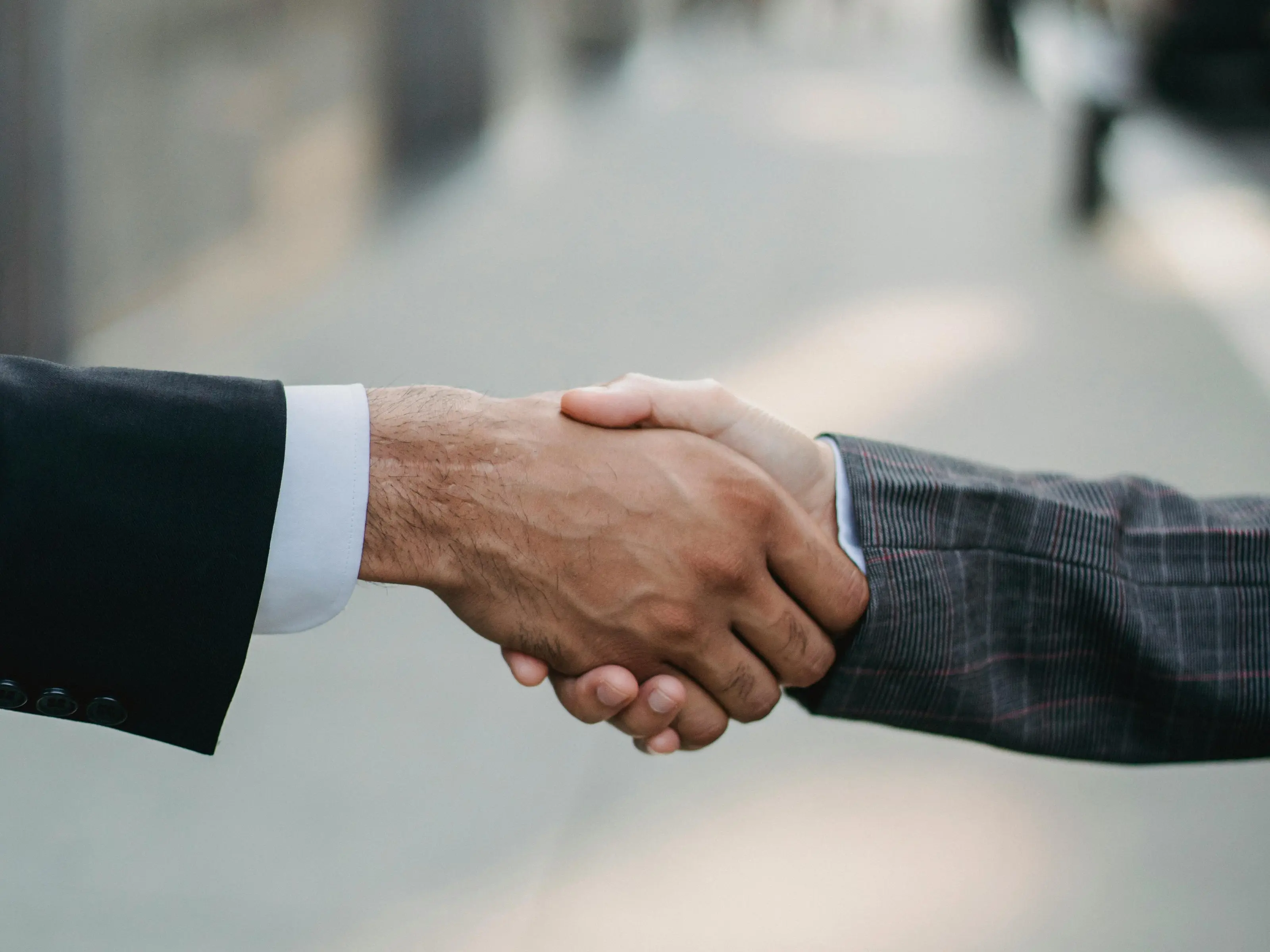 Business handshake representing trusted property management partnership